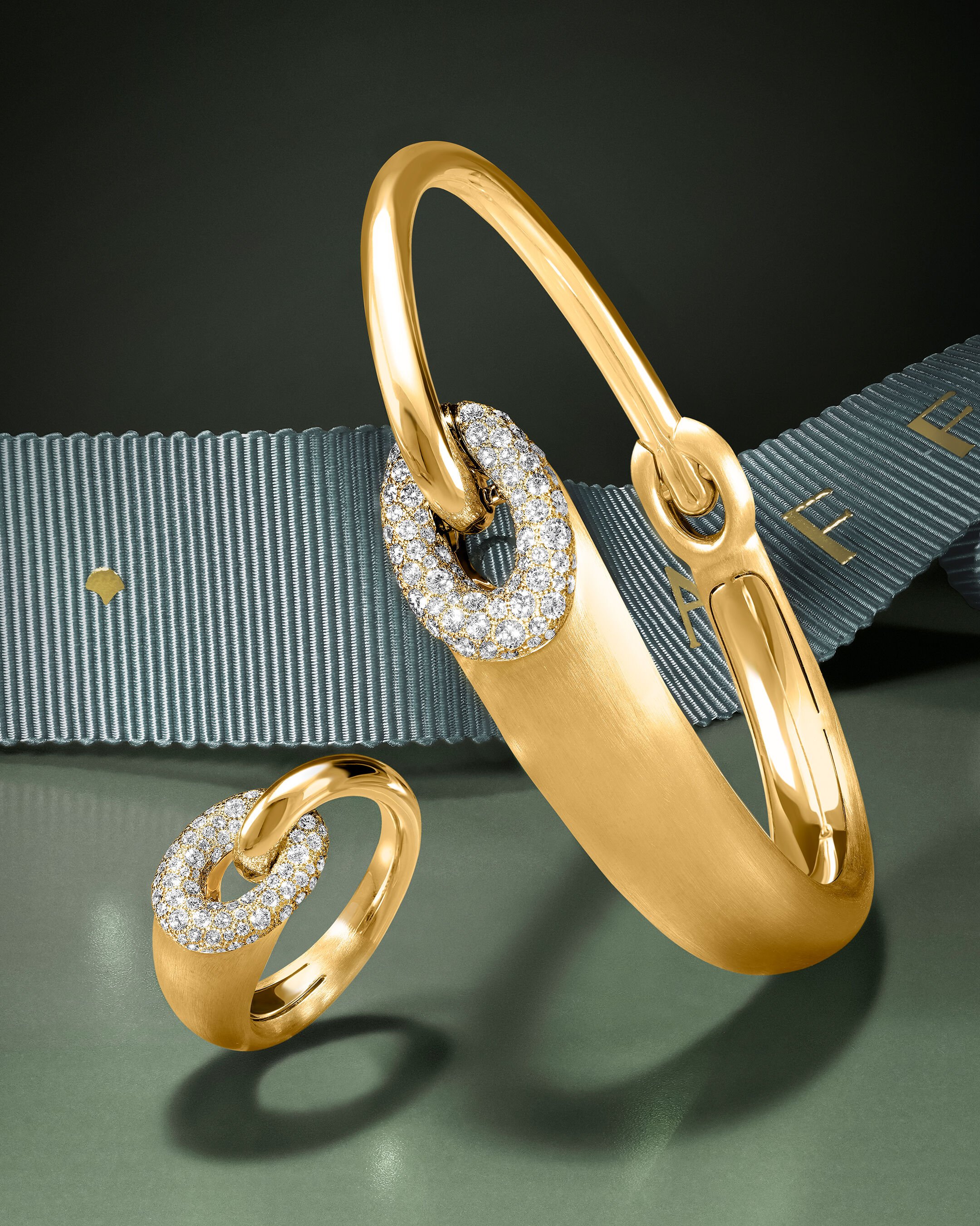 Image shows model wearing Laurence Graff Signature bangles and rings 