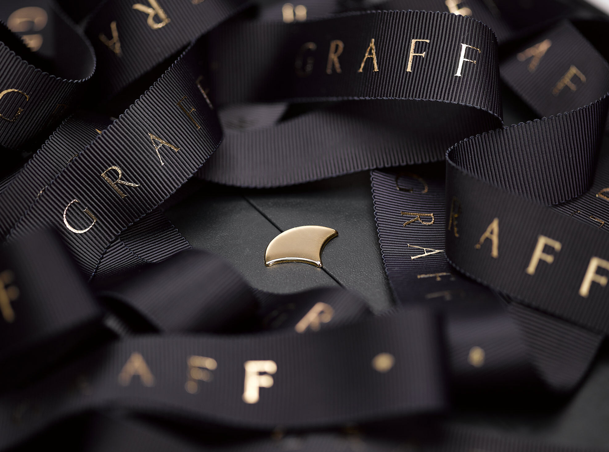 Close up of a Graff gift box with ribbons