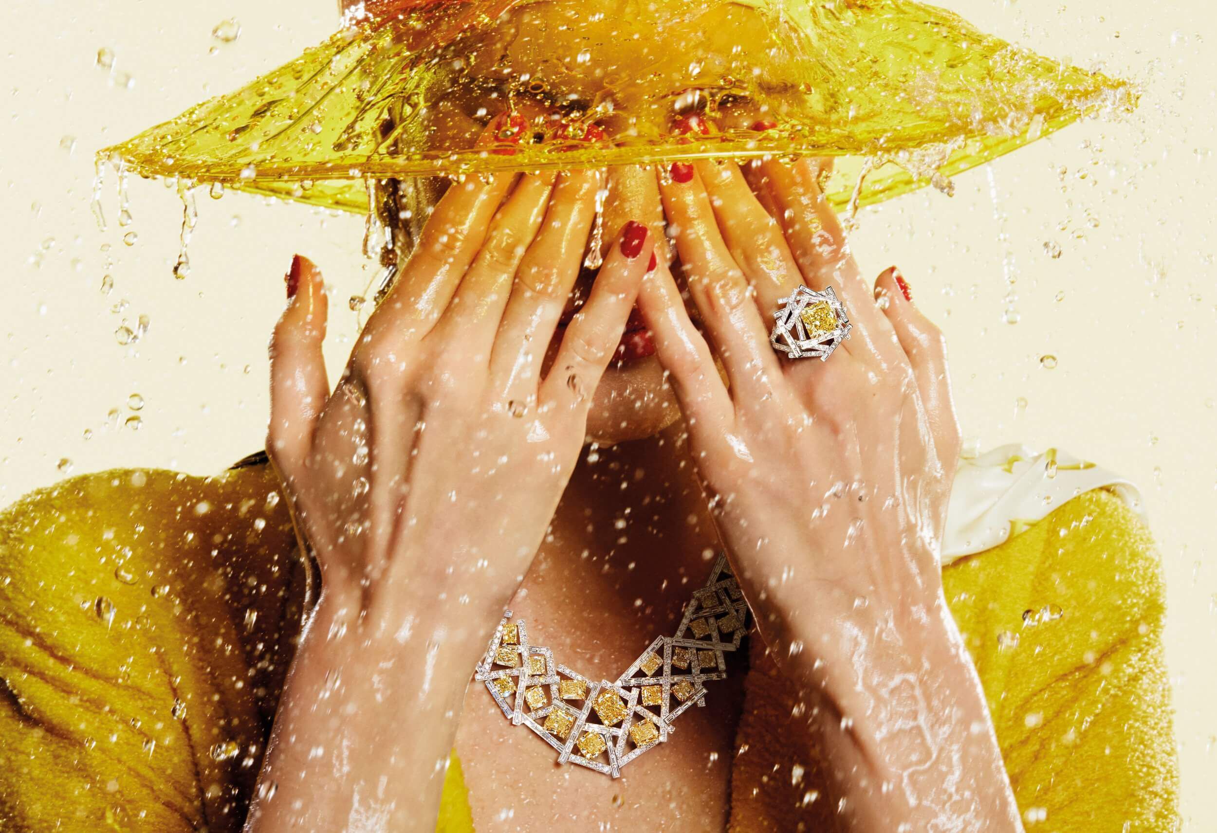 A model wearing Graff Threads Collection Yellow and White Diamond Ring and Necklace under rain