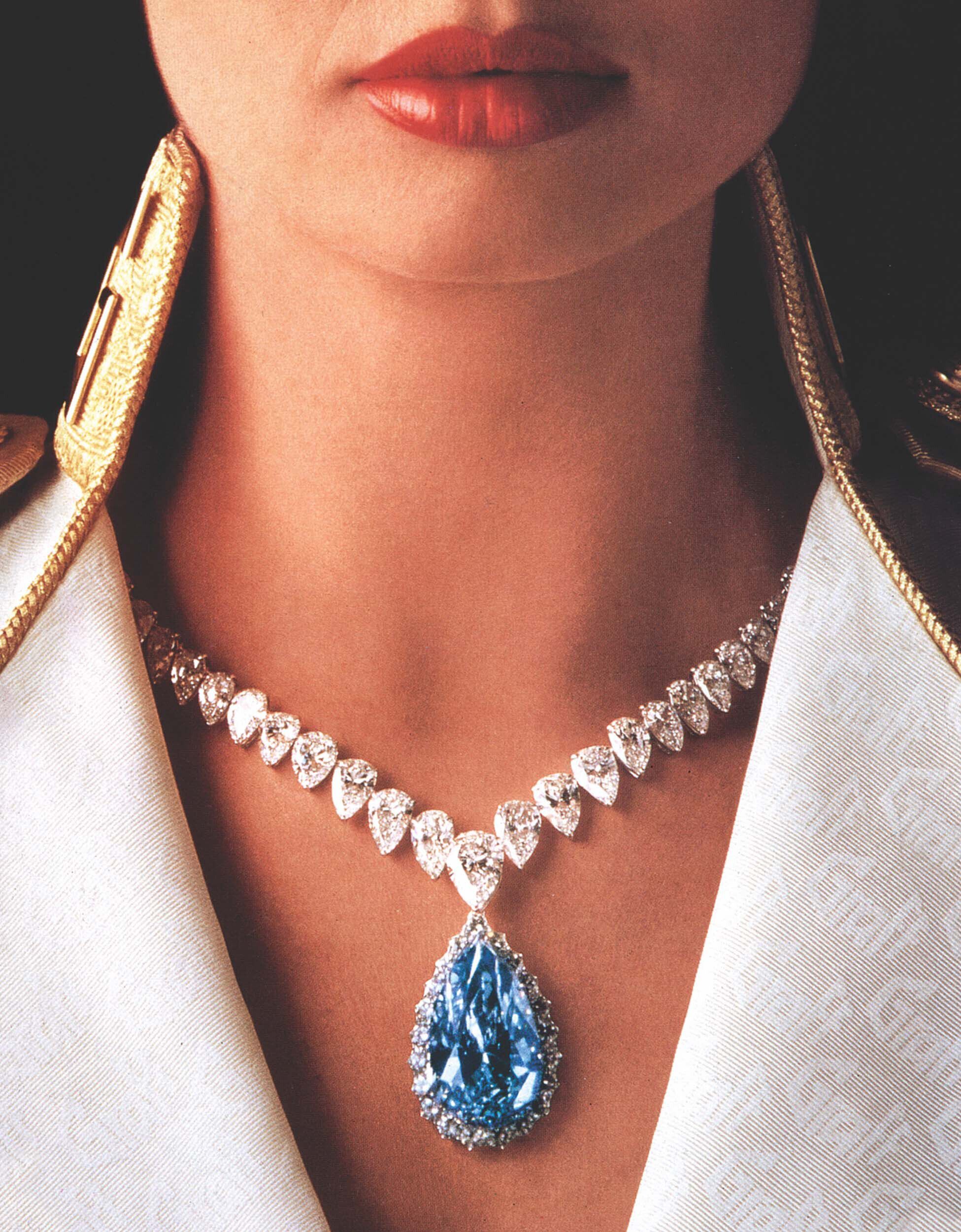 Close up of a model wearing a Graff blue and white diamond high jewellery necklace