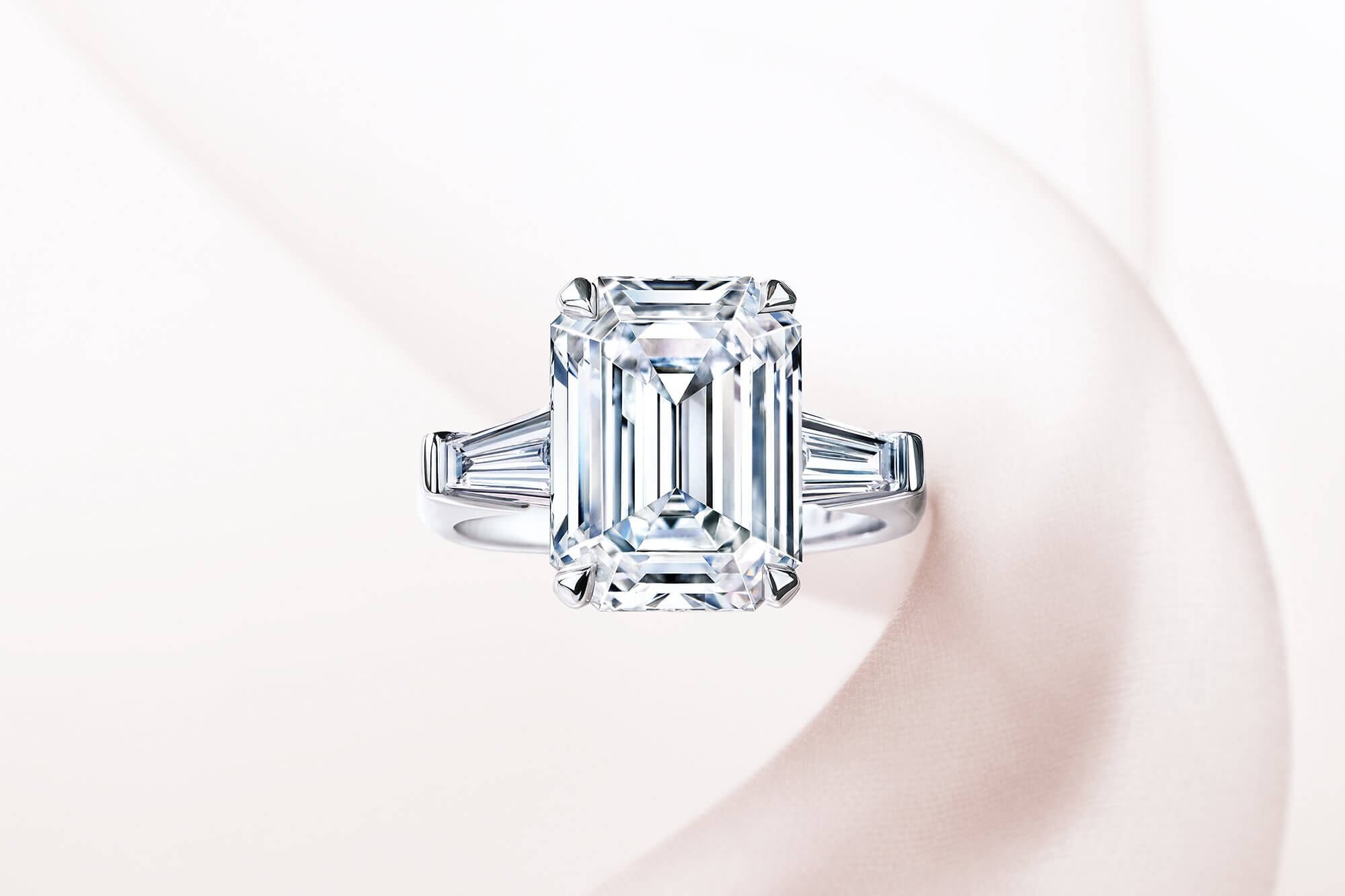 A Graff emerald cut diamond Promise setting engagement ring