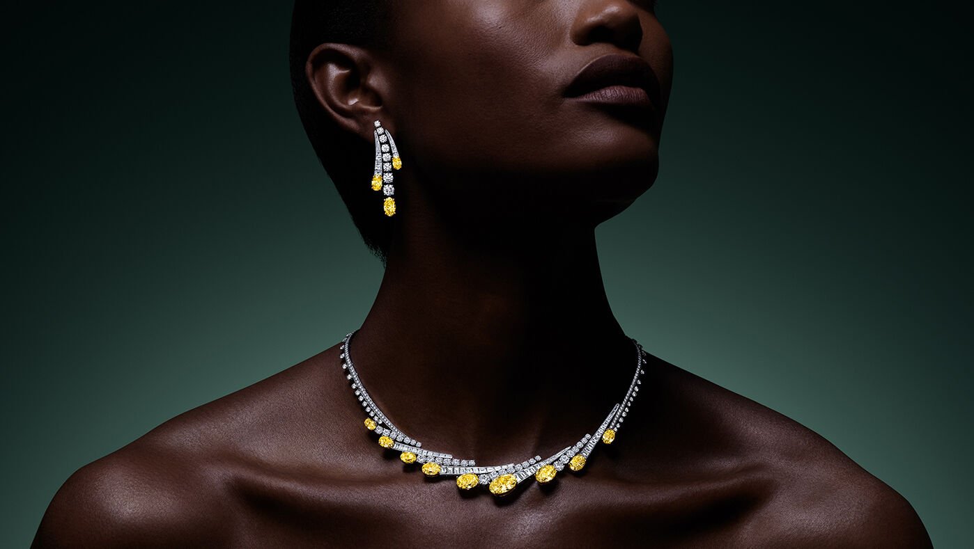 Image shows model wearing Graff Yellow Diamond High Jewellery suite