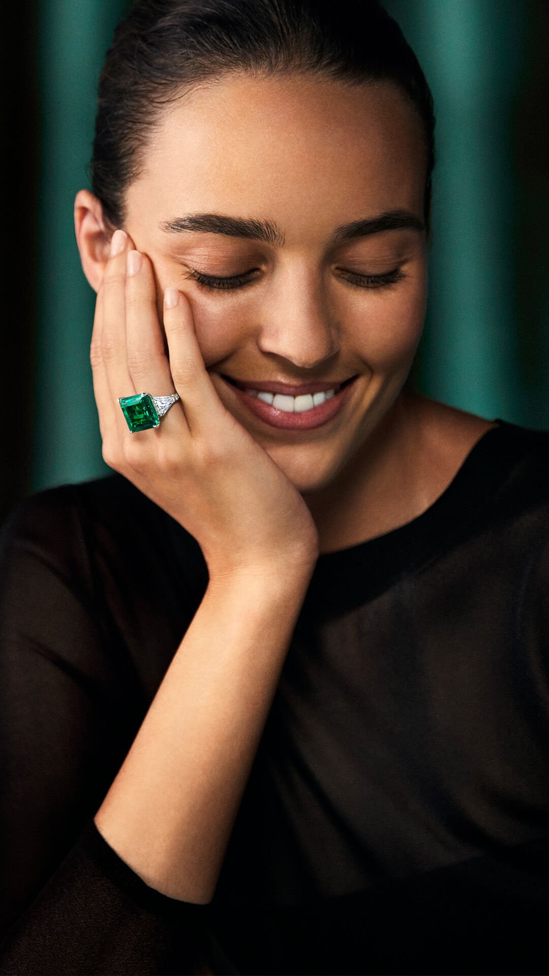 Image shows model wearing Graff Emerald Solitaire Ring 