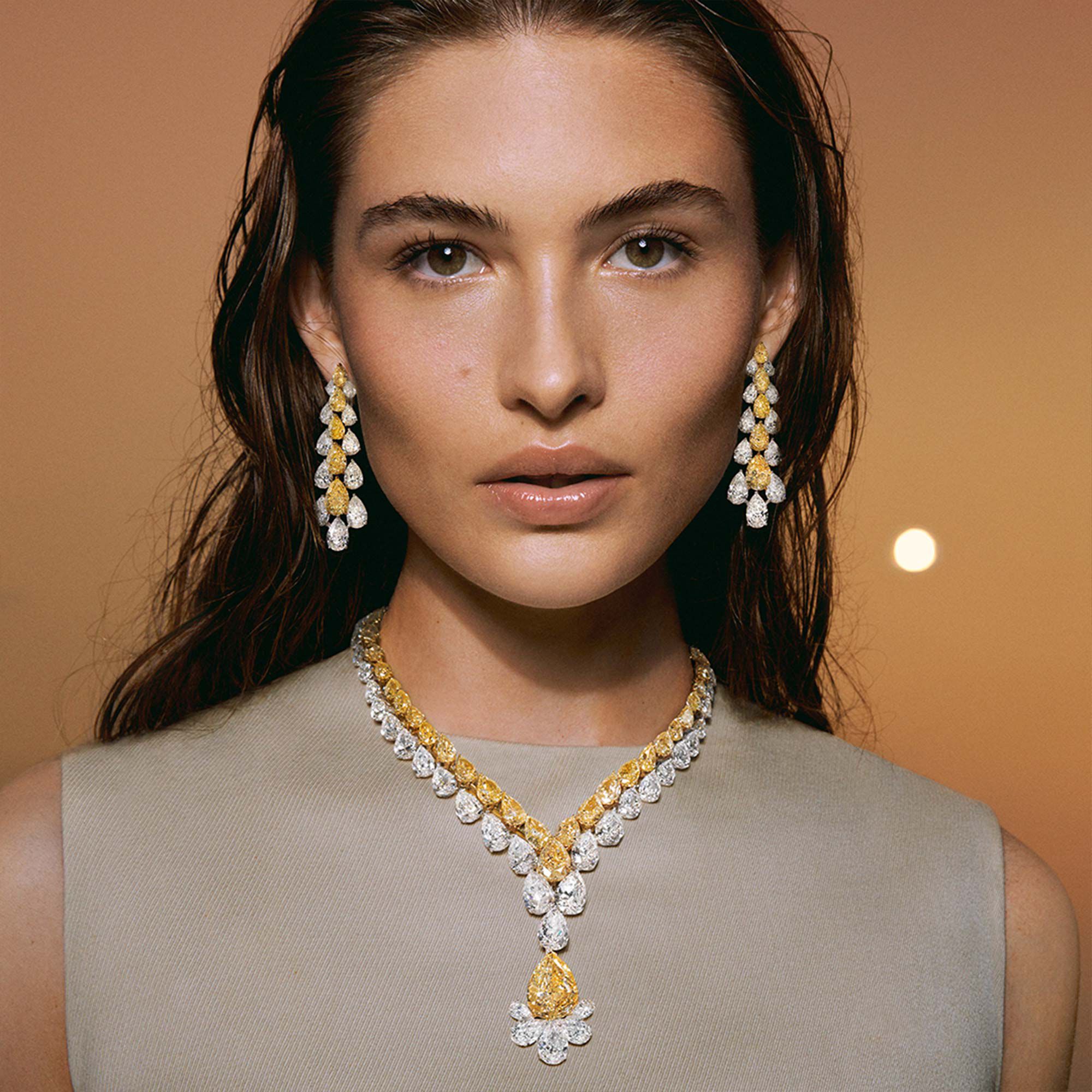 Model wears Graff High Jewellery Yellow and White Diamond Necklace and Earrings