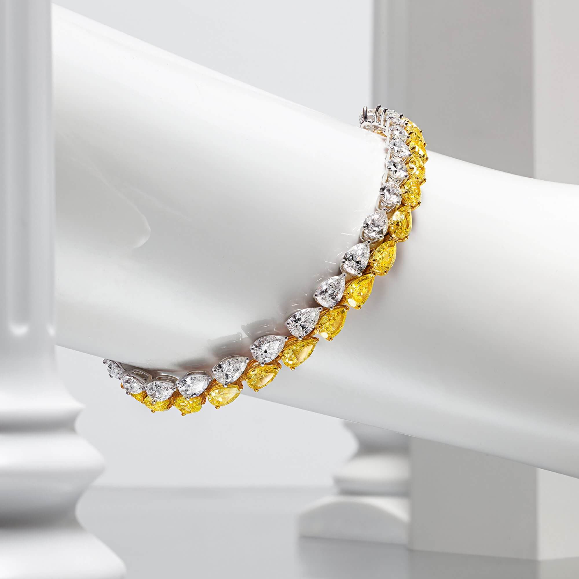 Graff Yellow And White Pearshape Diamond High Jewellery Earrings inside a Gallery.