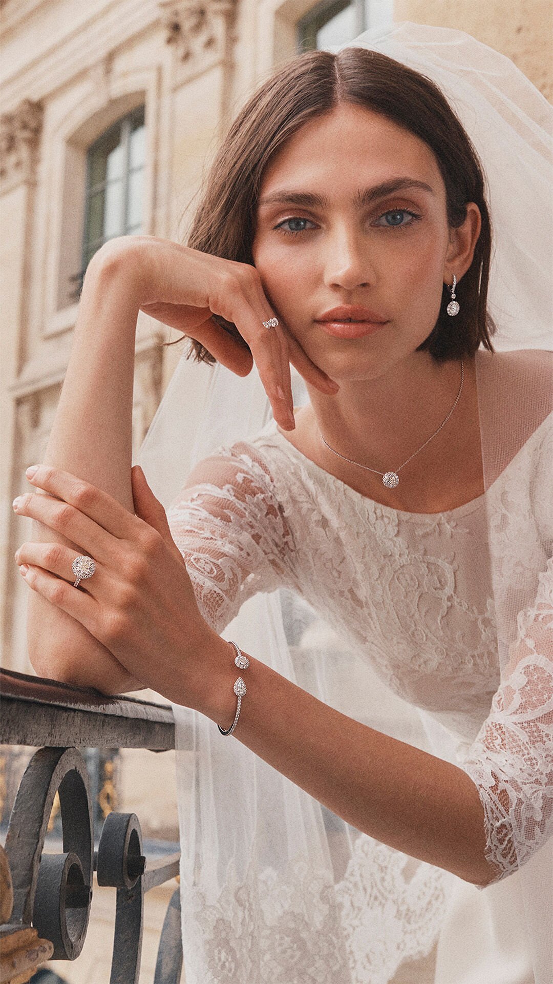 Image shows model wearing Graff oval diamond jewellery and icon oval engagement ring