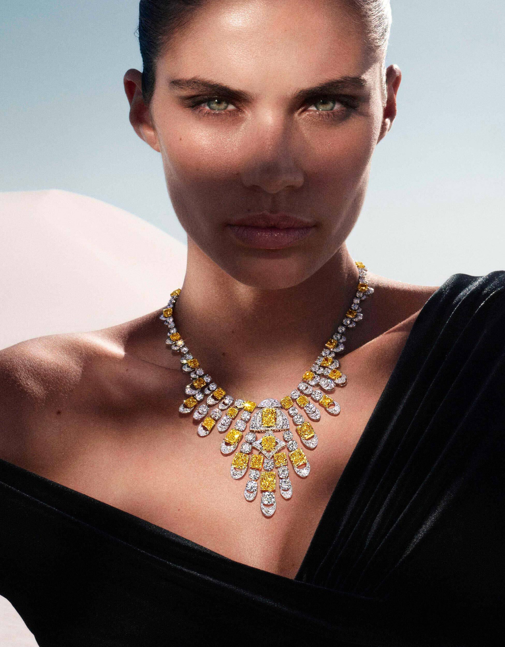 Sara Sampaio wears Graff Night Moon yellow and white diamond necklace, in a desert