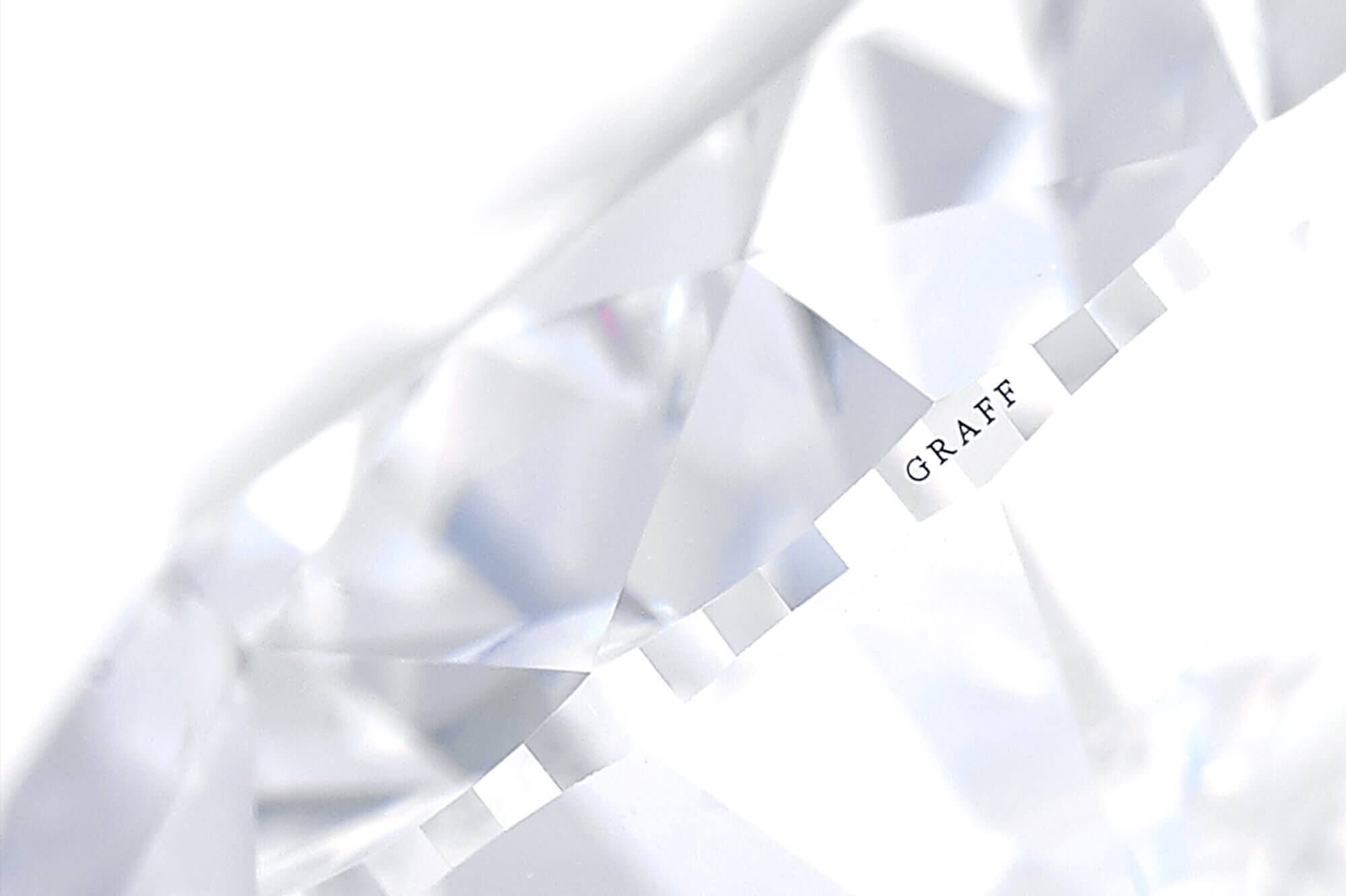 Close up of a Graff diamond with logo on the shank 