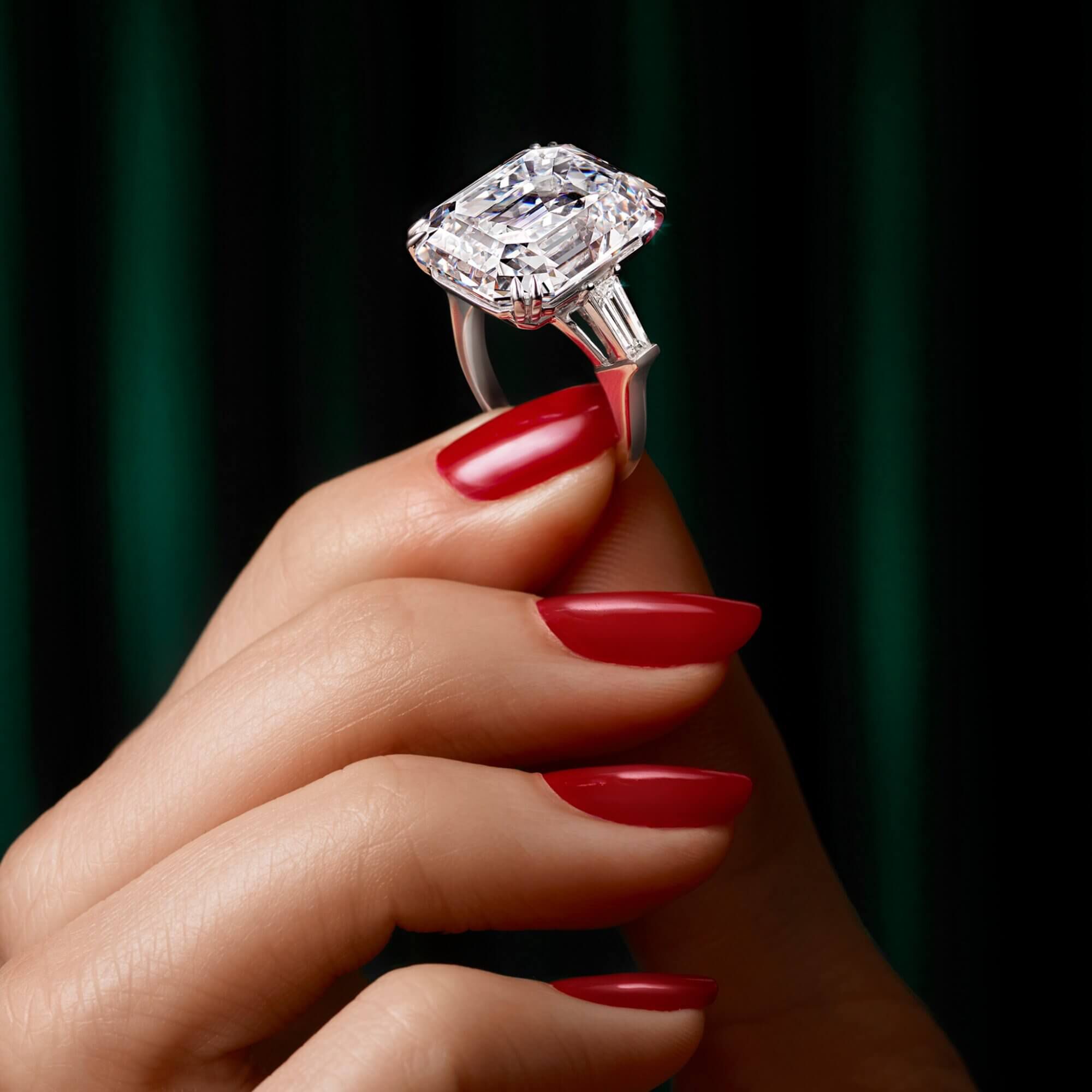 Model holding an emerald cut diamond ring from the Graff high jewellery collection