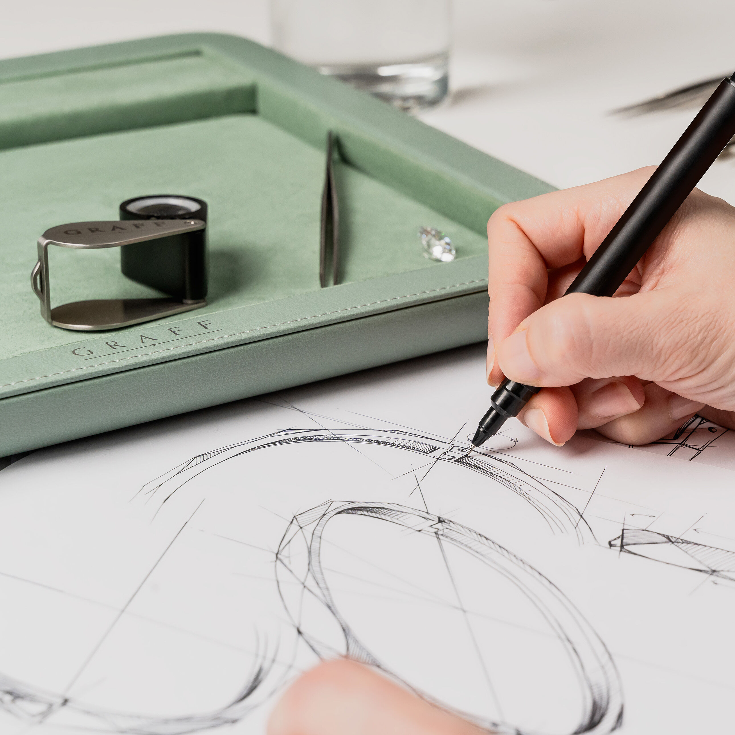 Image of designer sketching Laurence Graff Signature bangle 