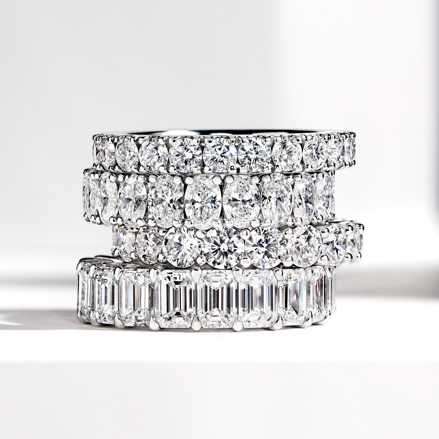 Eternity Bands for Women - Image shows model wearing Graff Emerald Cut White Diamond Eternity band