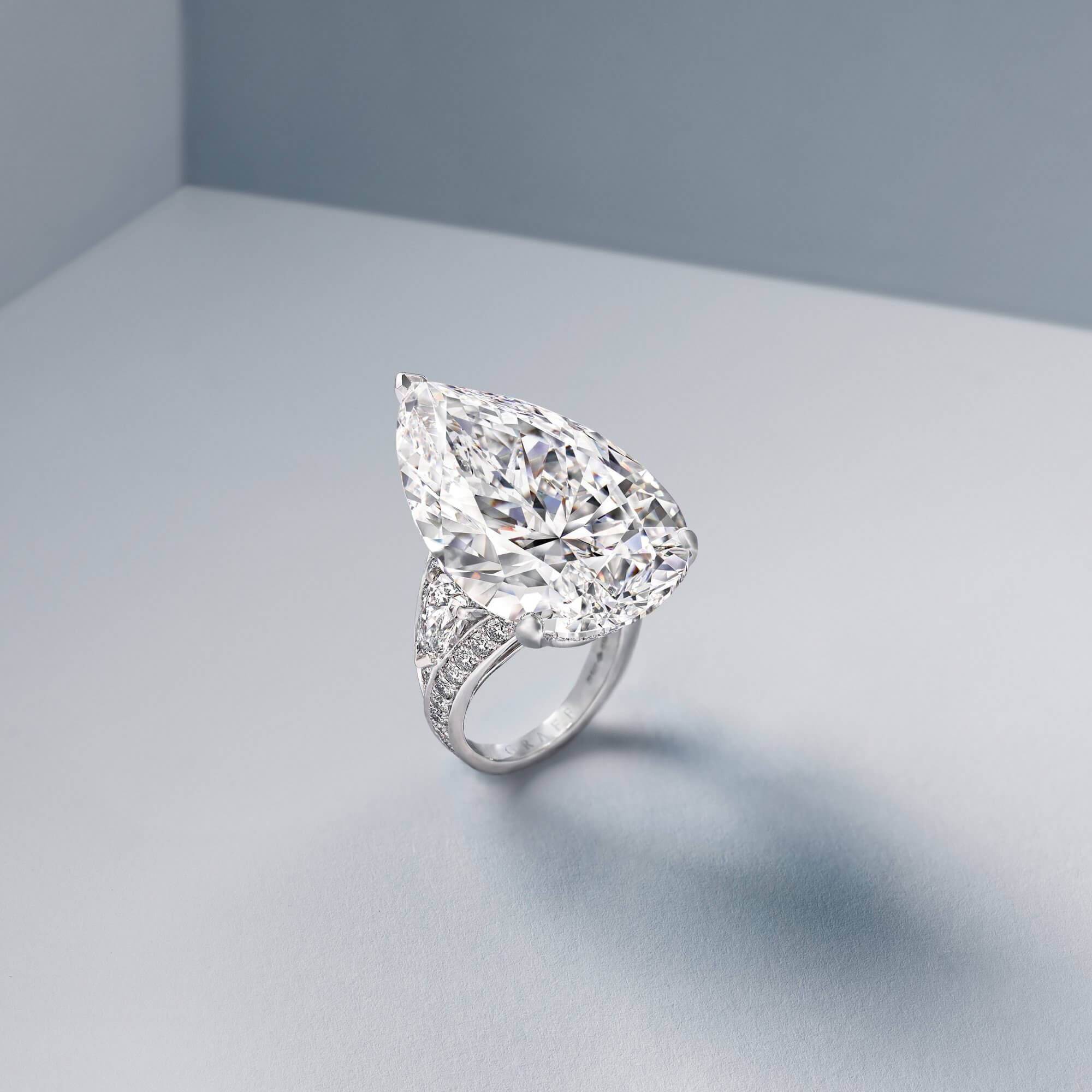 The very embodiment of contemporary elegance, the 38.13 carat D Flawless pear shape diamond ring (40.84cts) captures and scintillates the light in spectacular fashion.