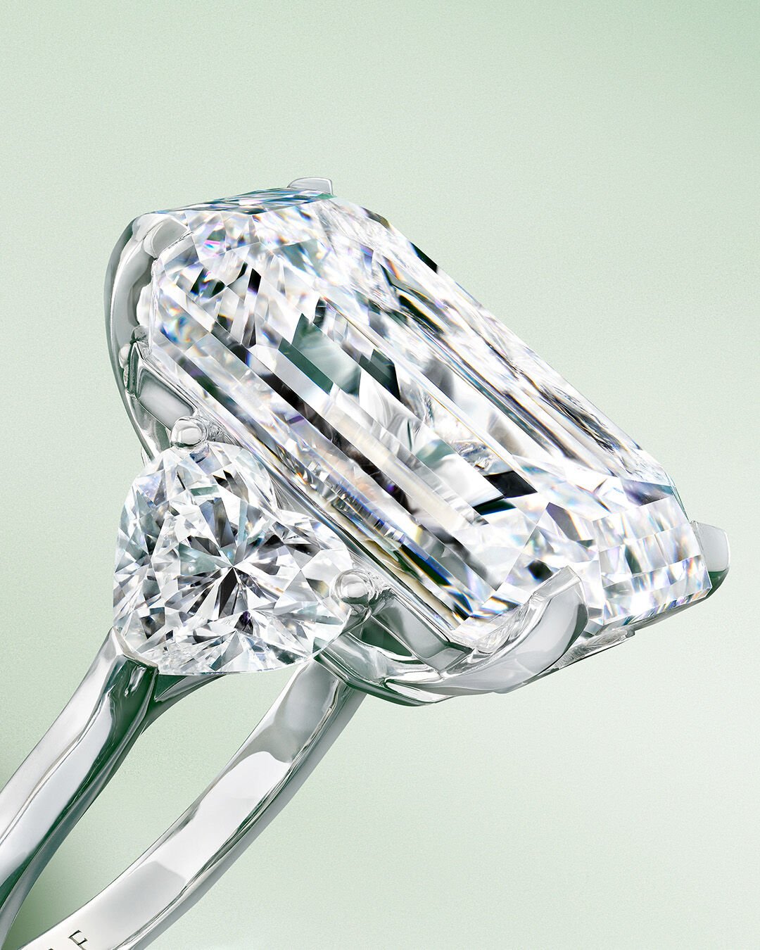 Image shows Emerald cut diamond engagement ring and Emerald cut eternity band