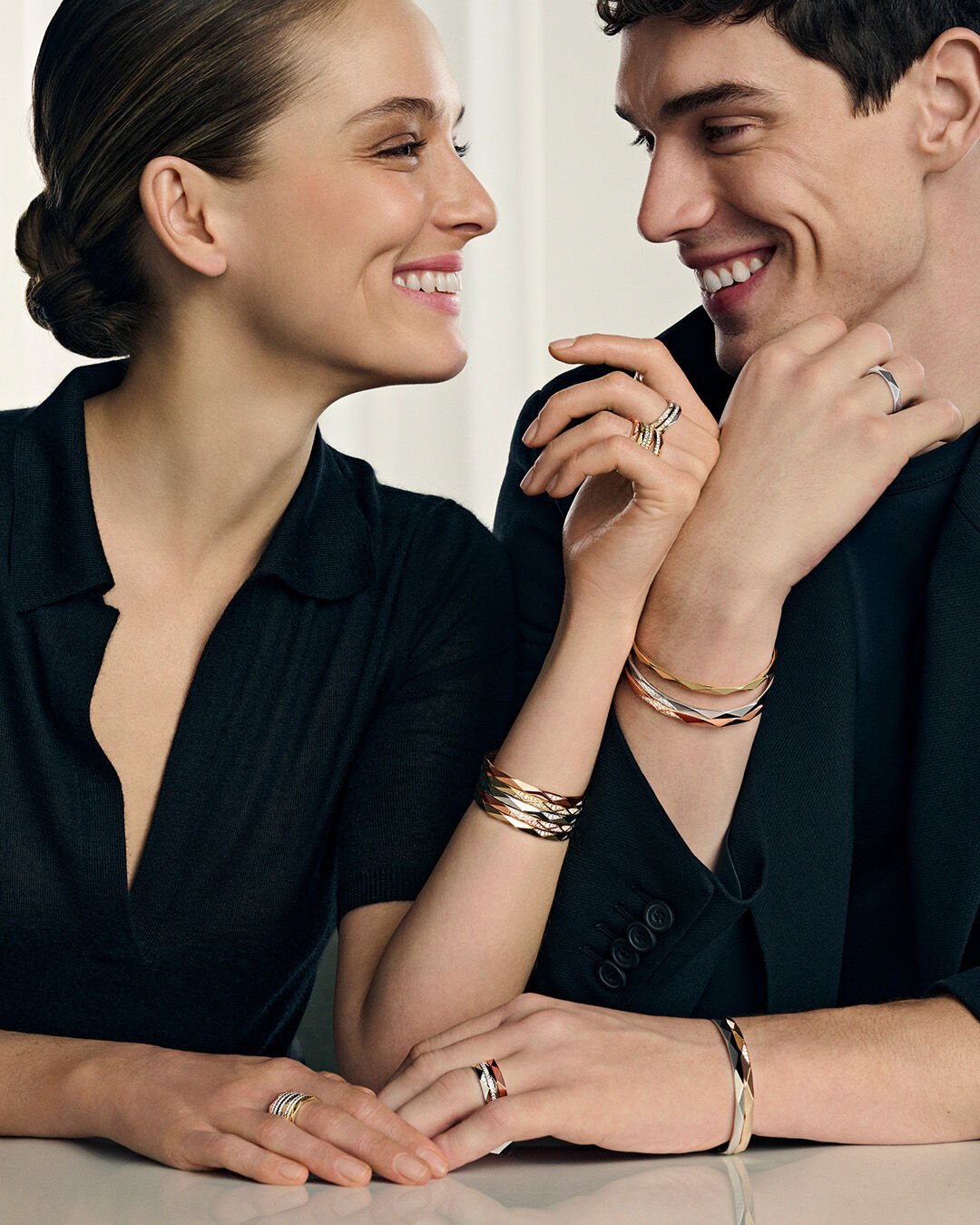 Couple Gifts - image shows models wearing Laurence Graff Signature collection rings and bracelets