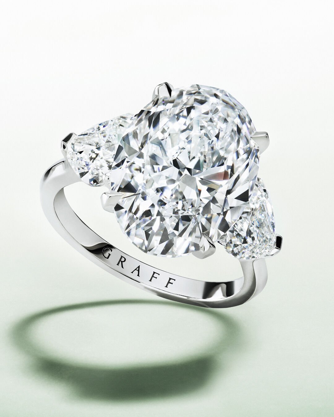 Image shows model wearing Graff heart shape line necklace, bracelet and heart shape engagement ring