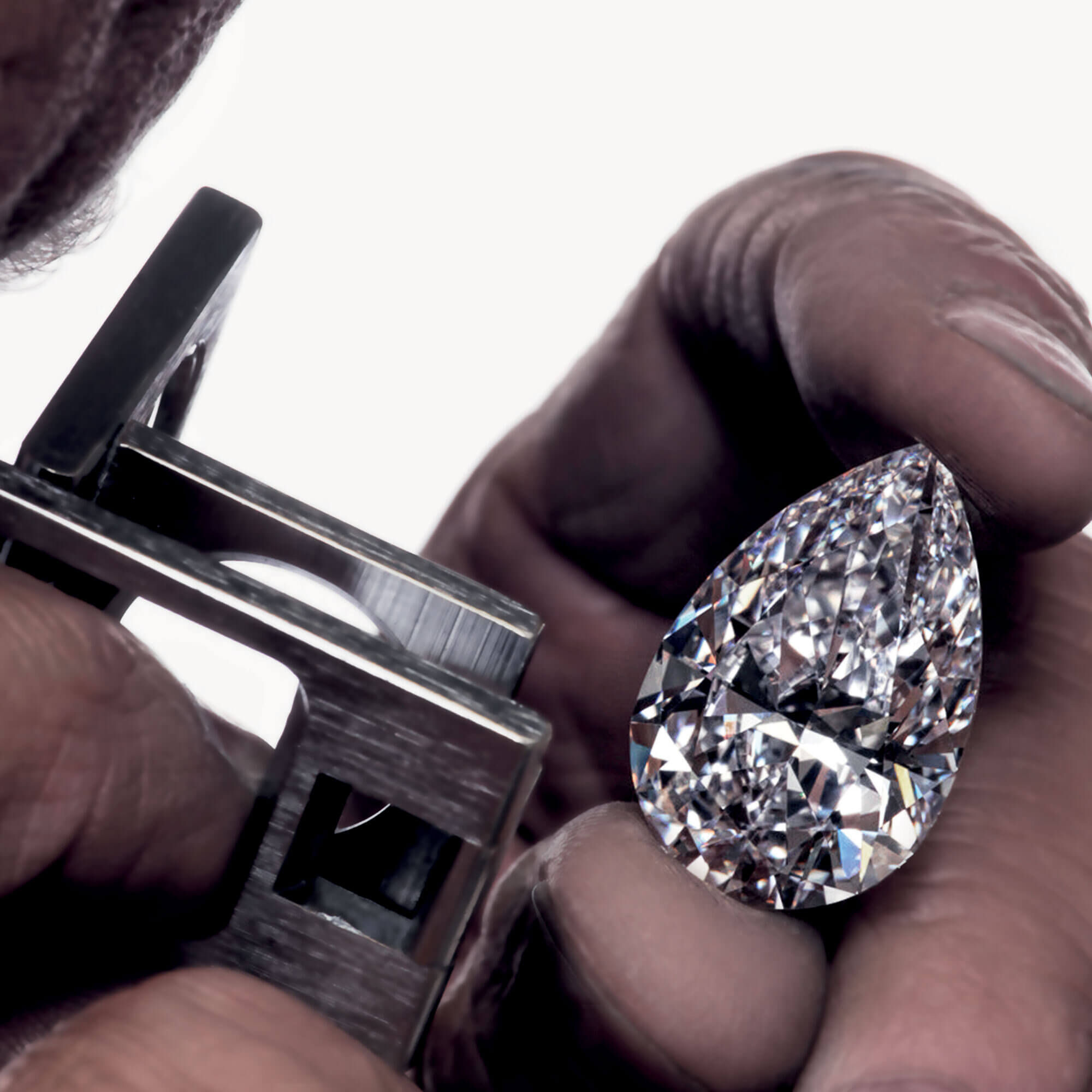 Close up of the Graff Vendôme pear shape diamond under examination 