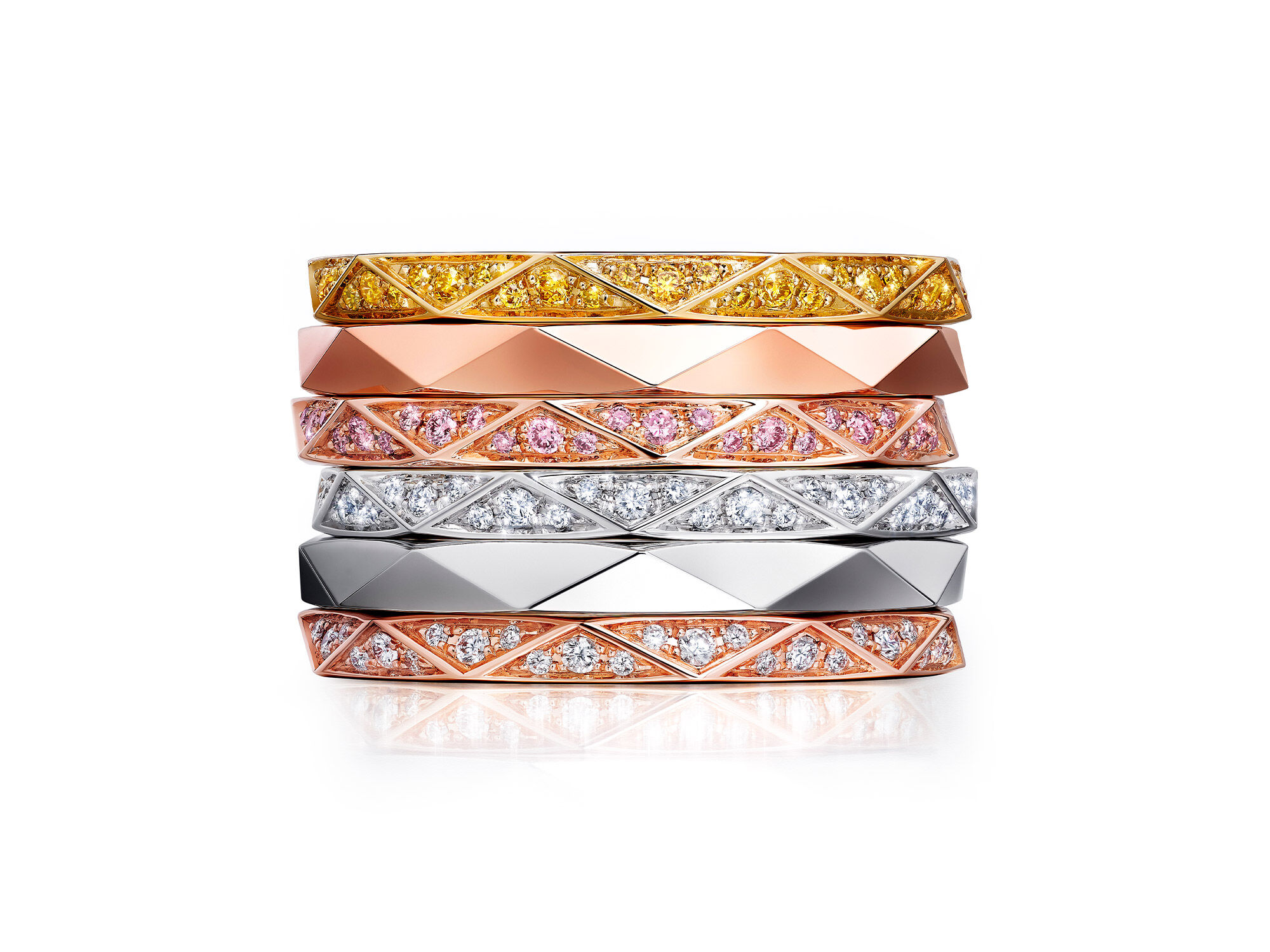 Stack of Laurence Graff Signature collection bands in yellow, rose and white gold 