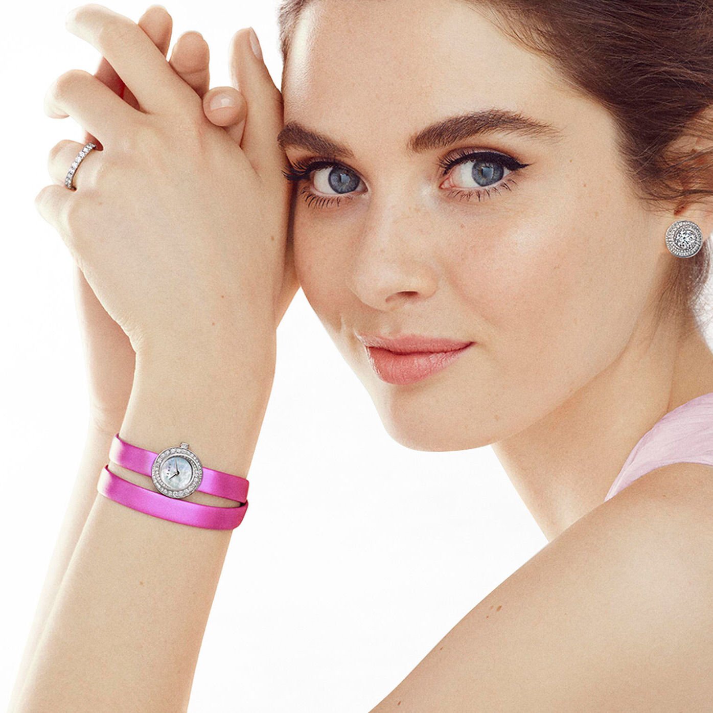 Model wears a Graff Spiral watch with a pink satin strap
