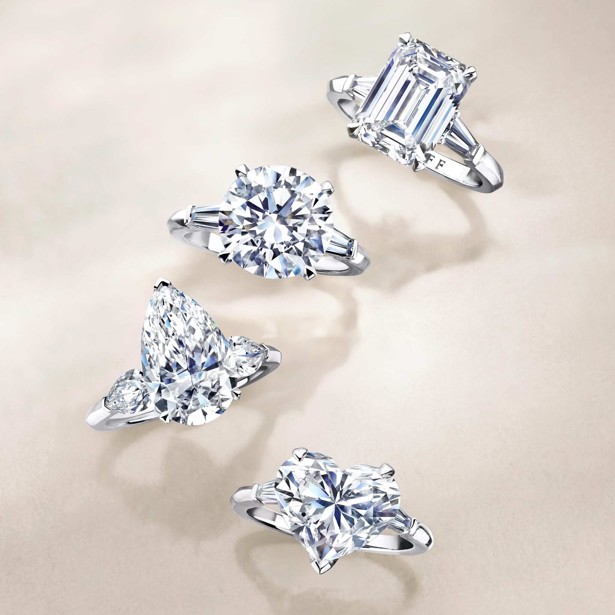 Three Graff promise engagement rings set with round diamond, pear Shape Diamond and Square Emerald Cut Diamond