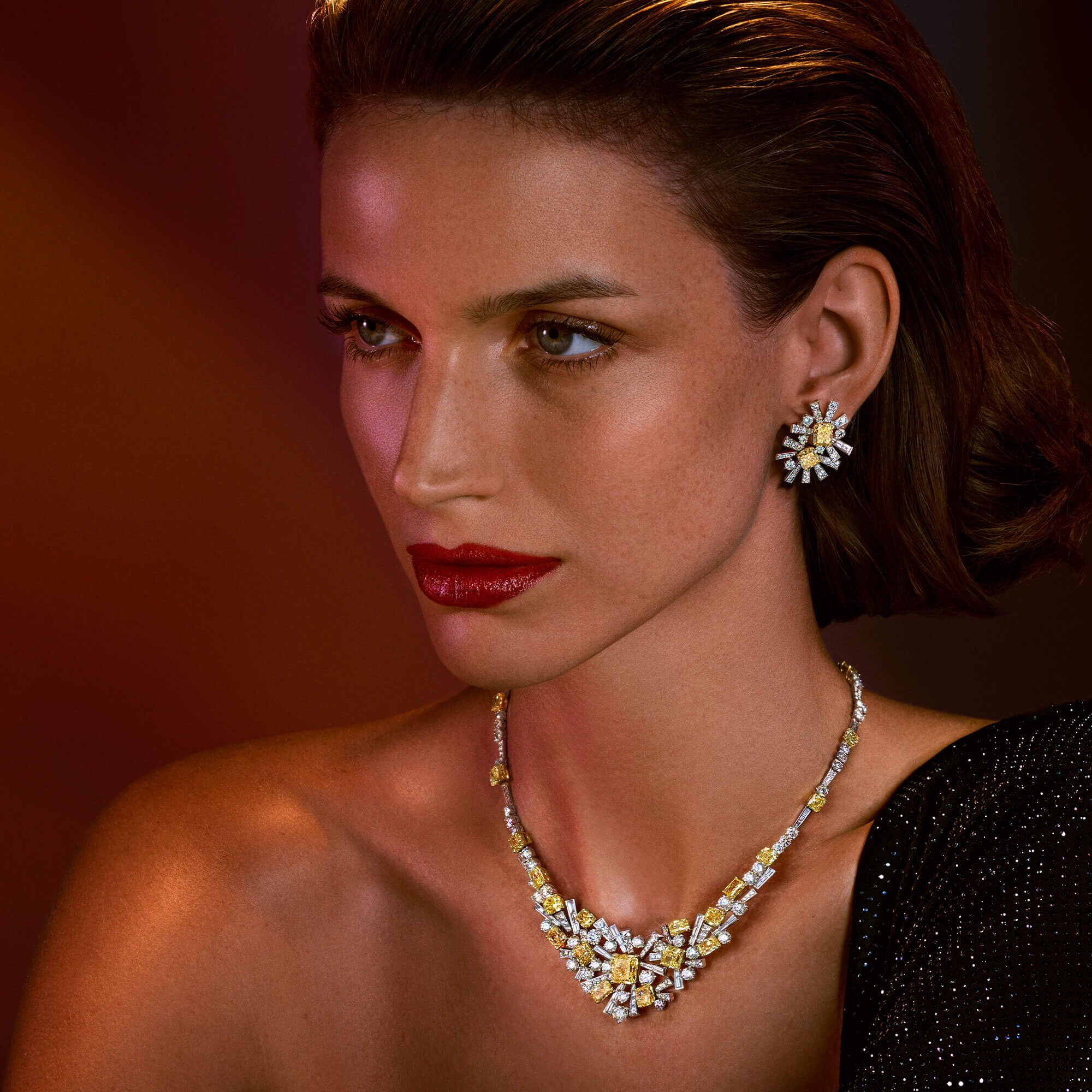 A model wears high jewellery Fancy Yellow and white diamond Threads necklace and earrings from the Graff high jewellery collection
