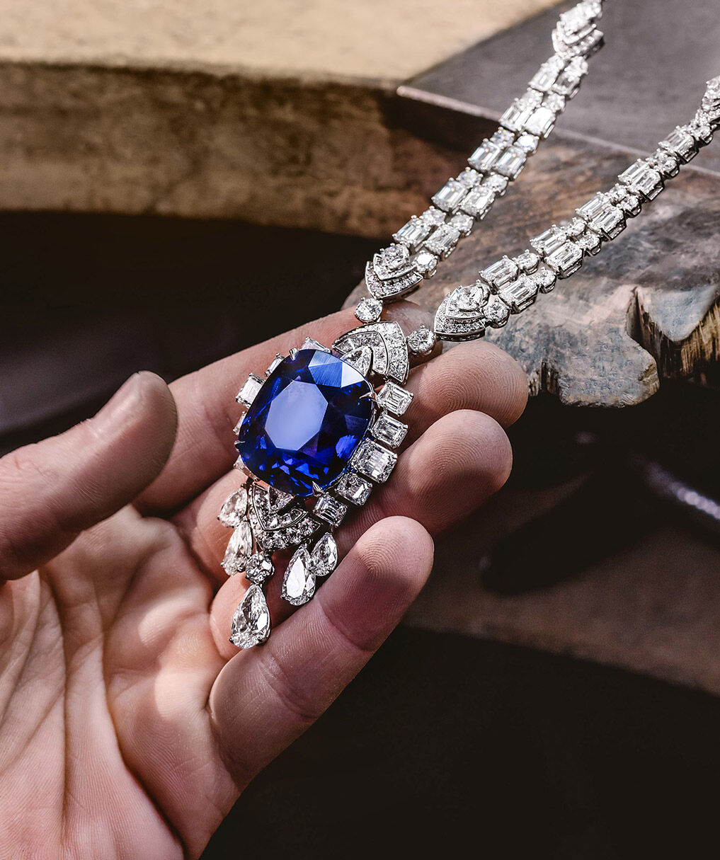 Graff Craftsman holding Sapphire and Diamond Necklace 