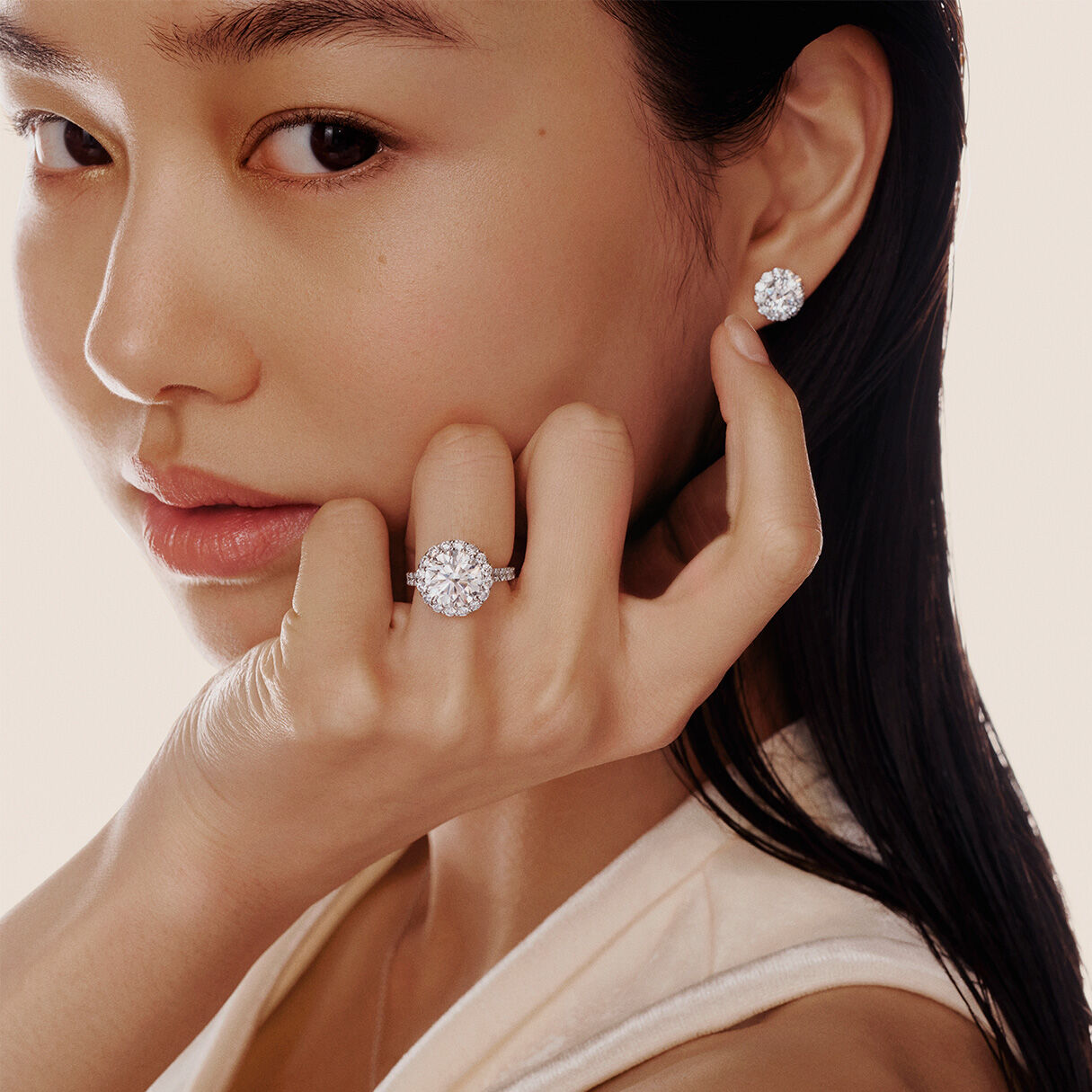 Model wears Graff Diamond Engagement Rings and Diamond Earrings