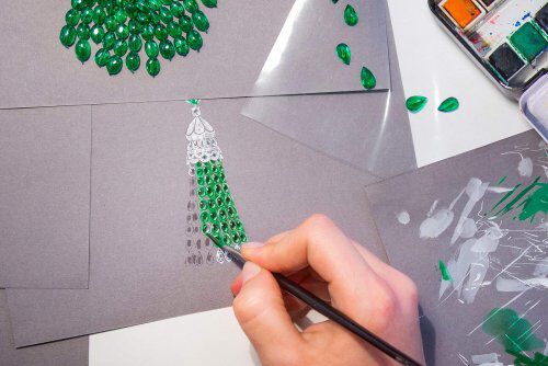 A Graff designer handplanting a gouache of an emerald and diamond necklace