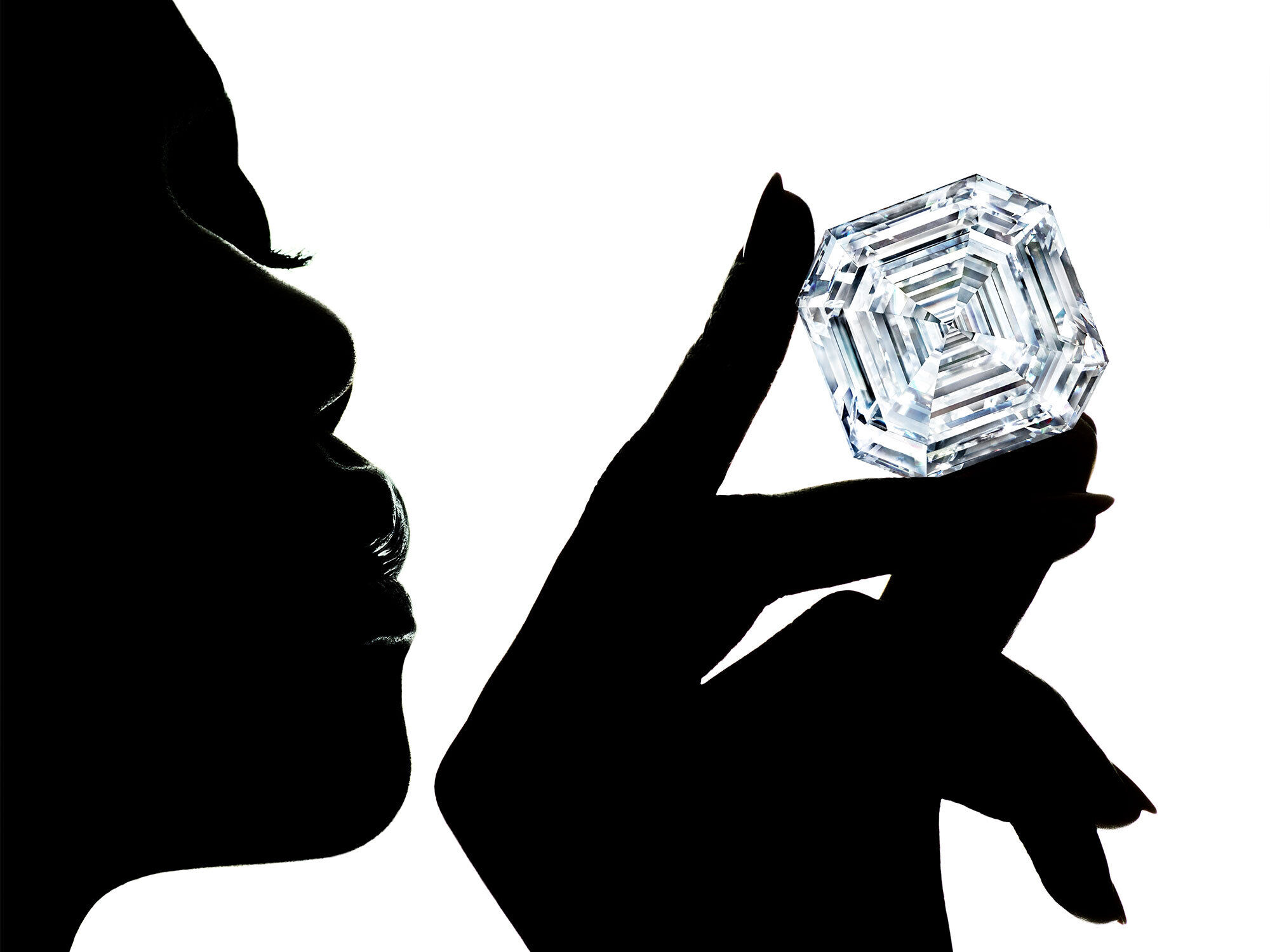 Shadow of model holding the Graff Lesedi La Rona diamond.