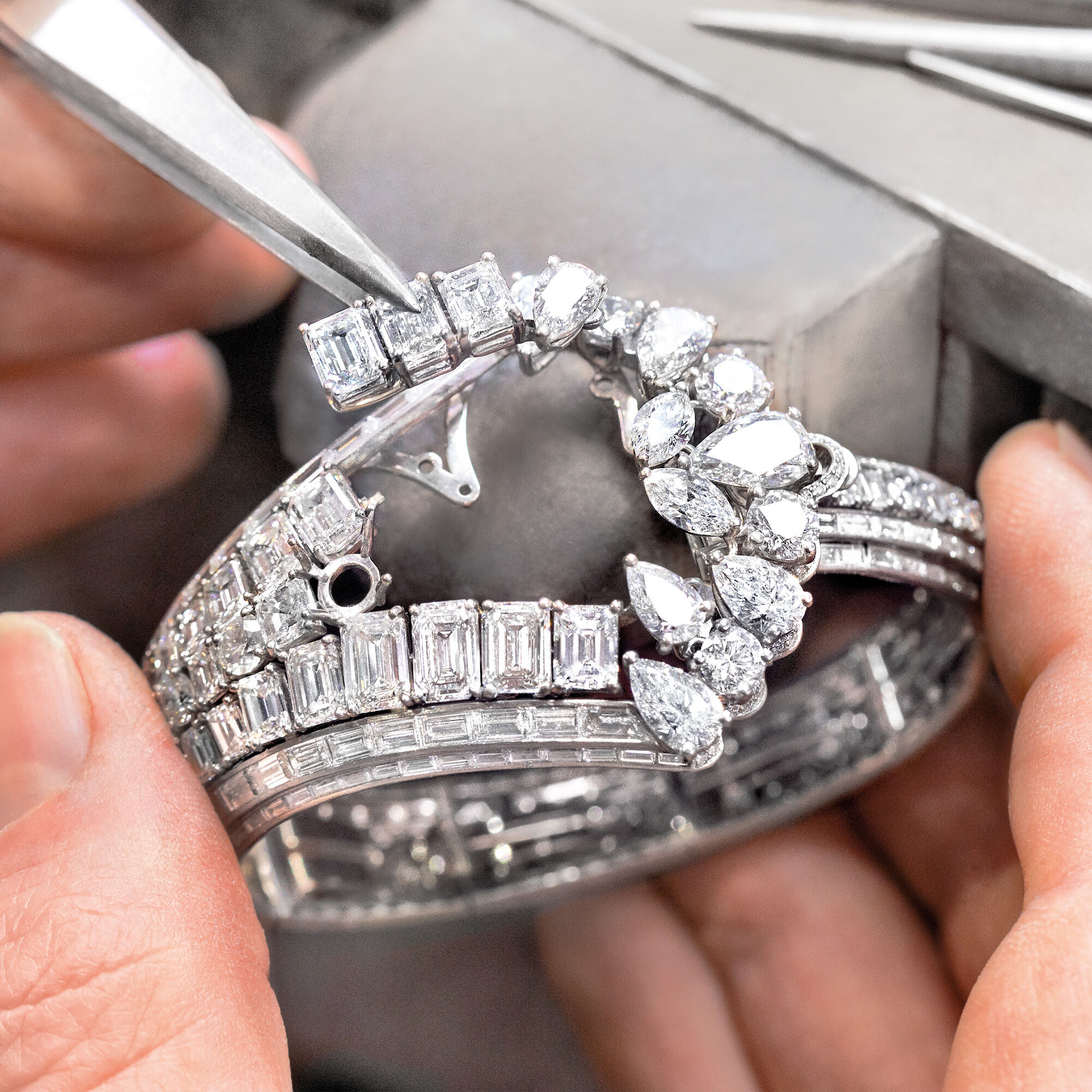 Garff Diamond setter seting the Graff Oval Diamond Secret Watch from the Graff unique timepieces collection