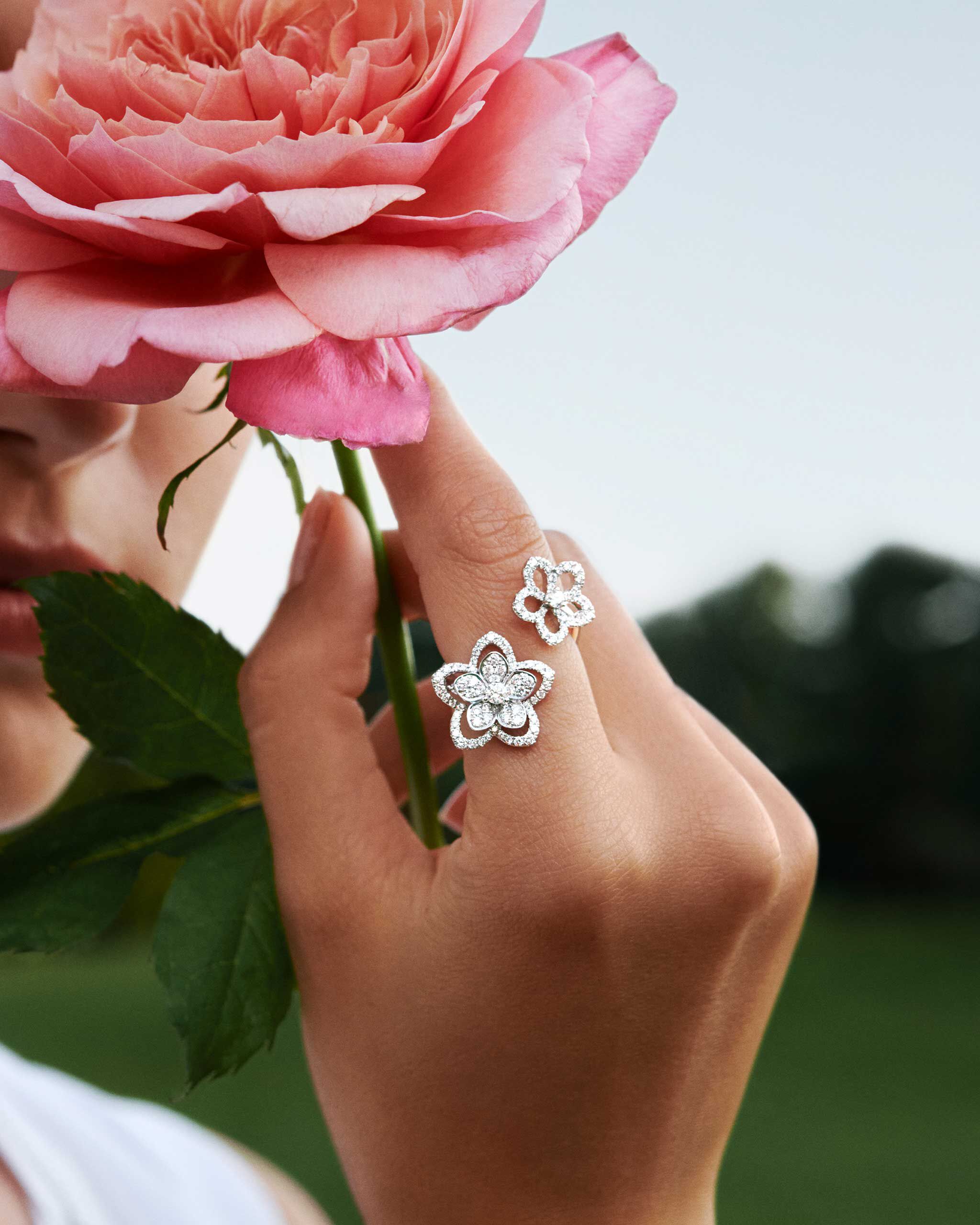 Model's hand shown wearing Graff Wild Flower diamond ring