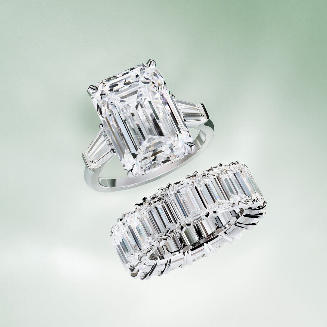 Image shows a pair of Diamond rings from Graff with Emerald cut stones.