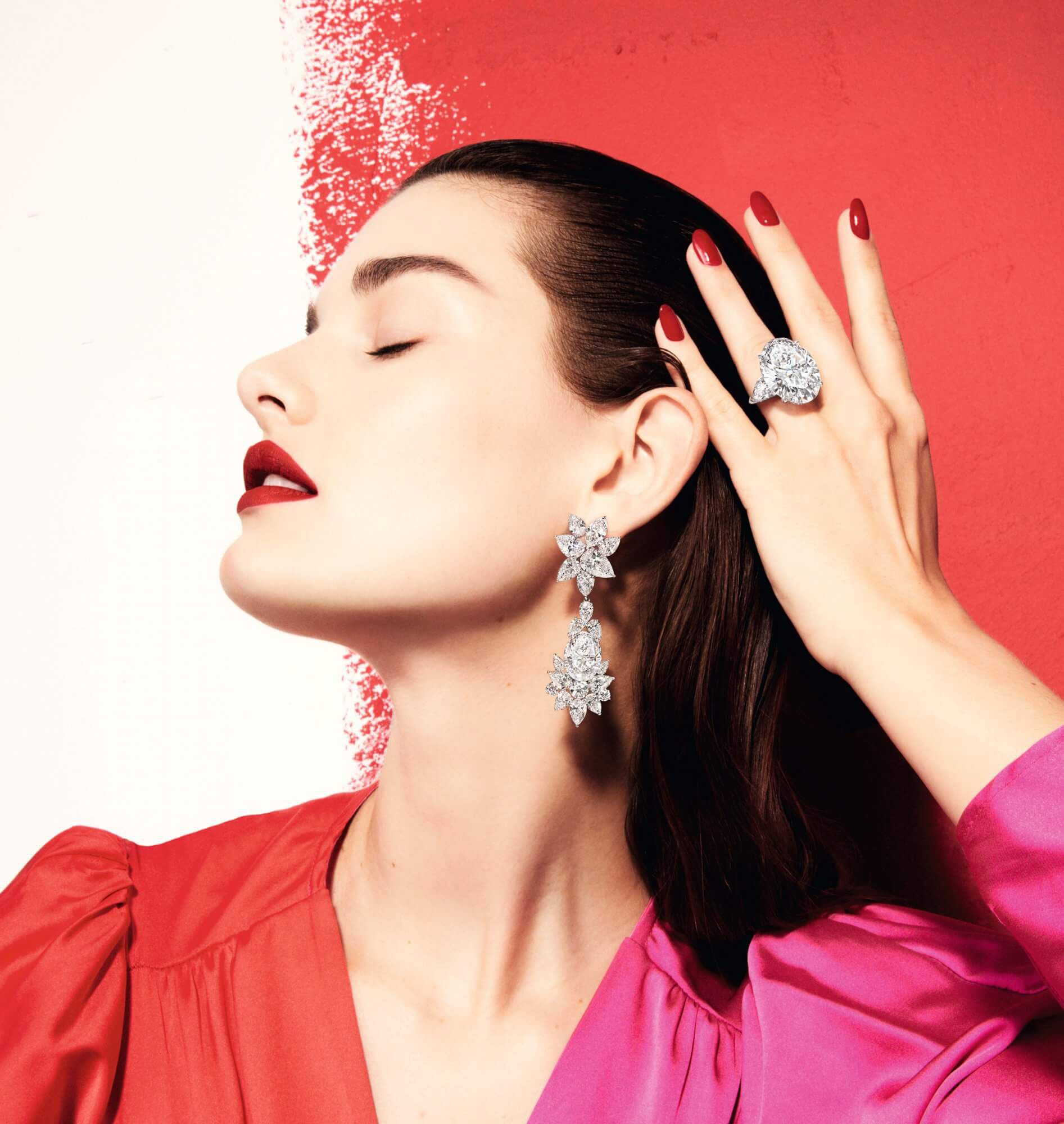 Model wears Graff white diamond high jewellery earrings and ring