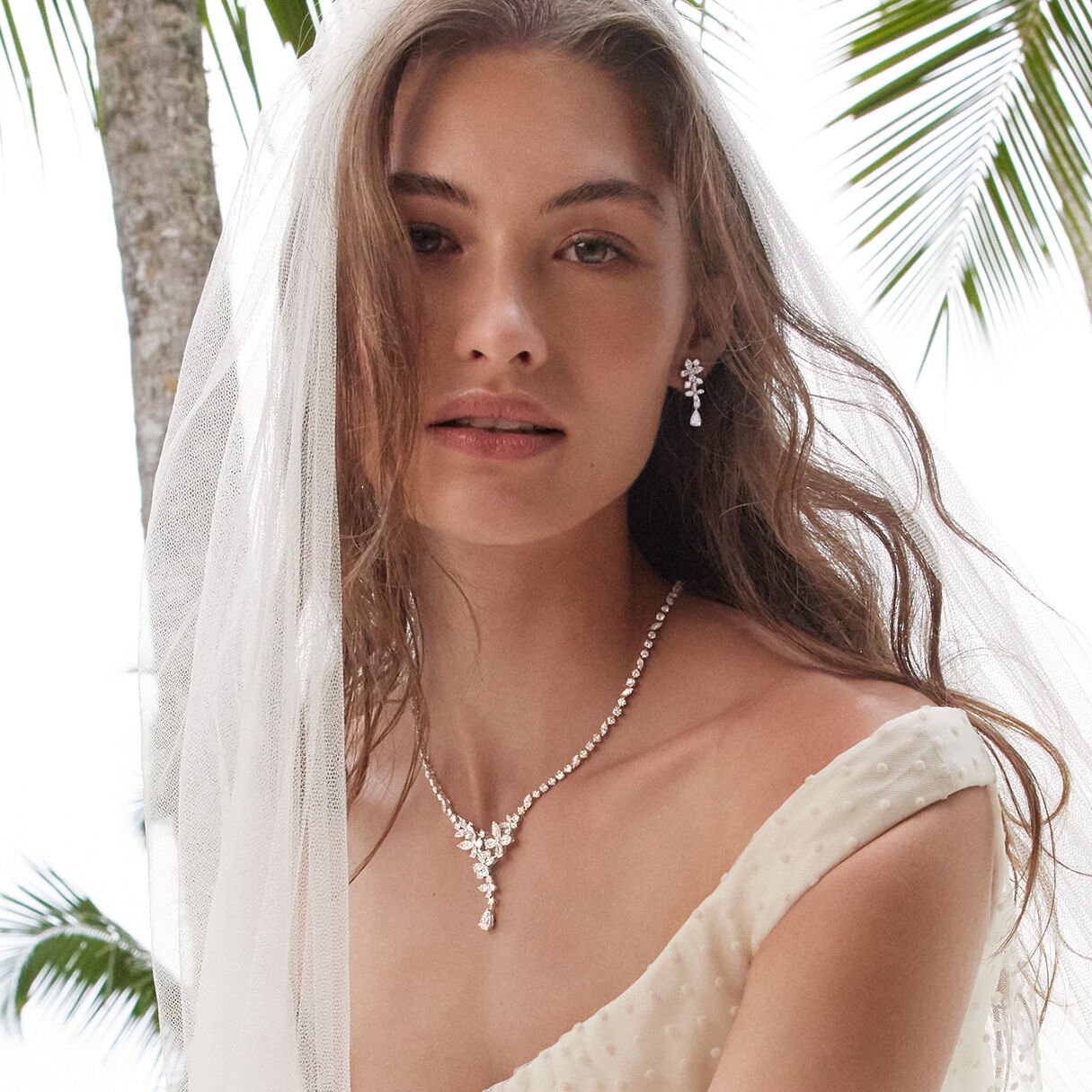 Model wears Graff Bridal Jewellery Earrings and Necklace
