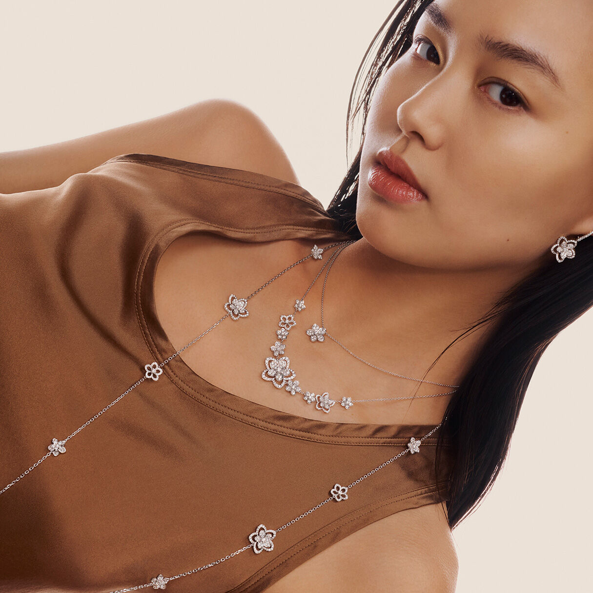 Necklaces & Pendants, model wears Wild Flower jewellery showcasing necklaces
