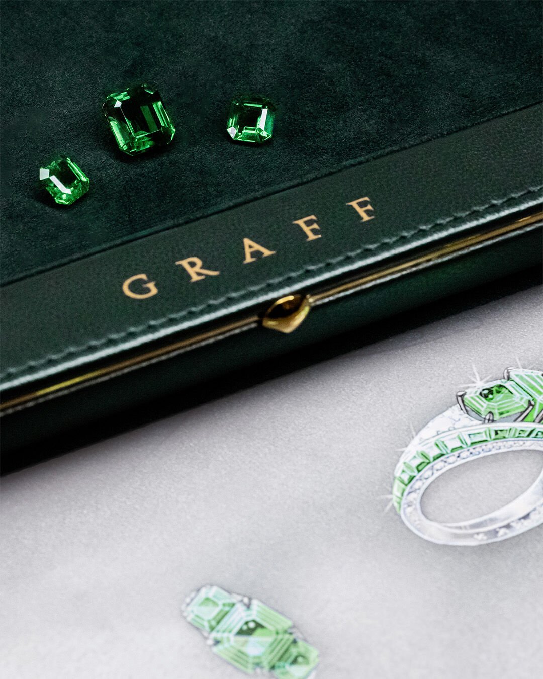 Image of Graff Emerald and White Diamond Solitaire ring, side view 