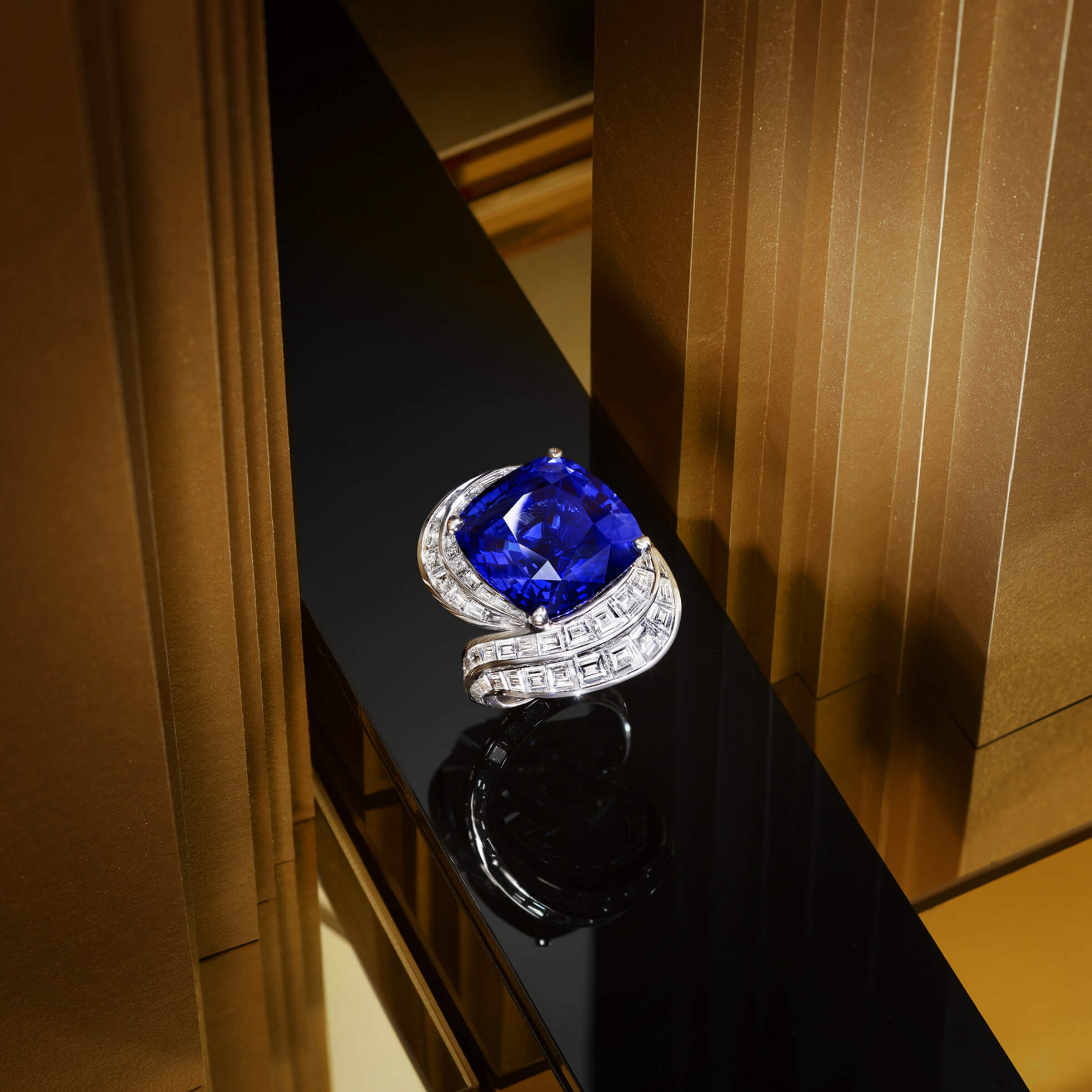 A Graff Sapphire and Diamond Ring featuring a 22.84 ct cushion cut sapphire.