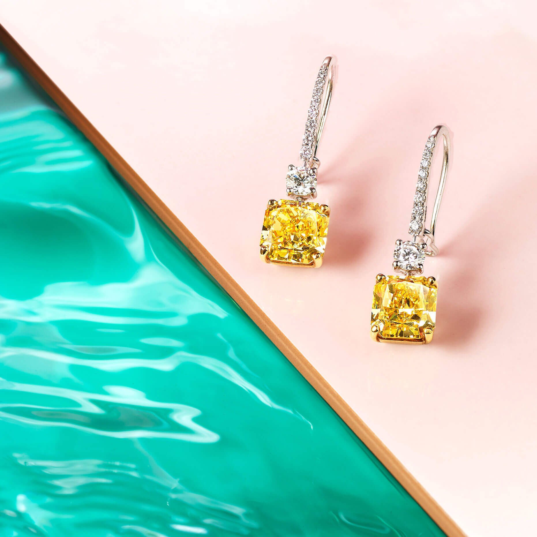 Graff Classic Graff collection Yellow and white diamond earrings at a pool side