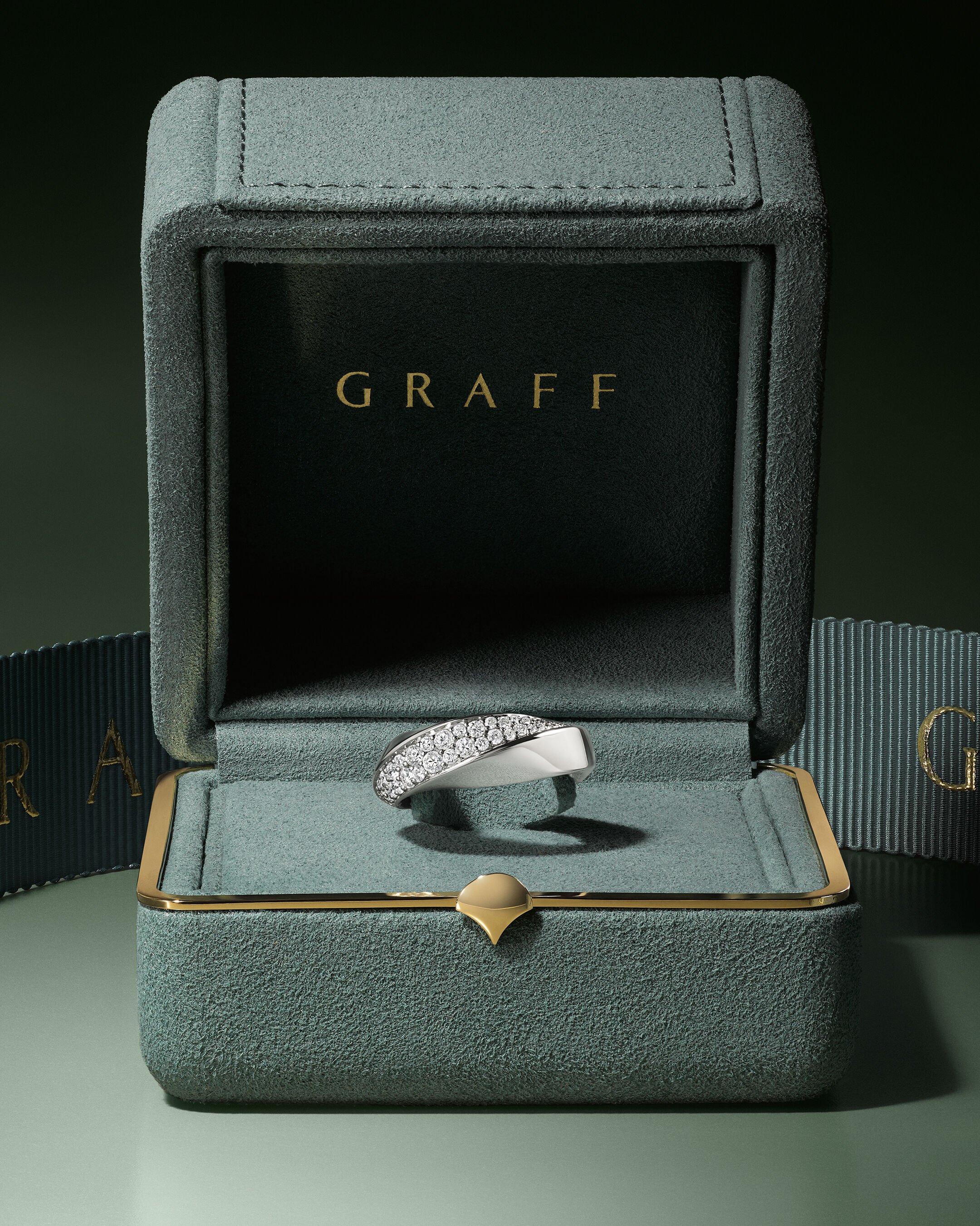 Image shows model wearing Laurence Graff Signature bangles and rings 