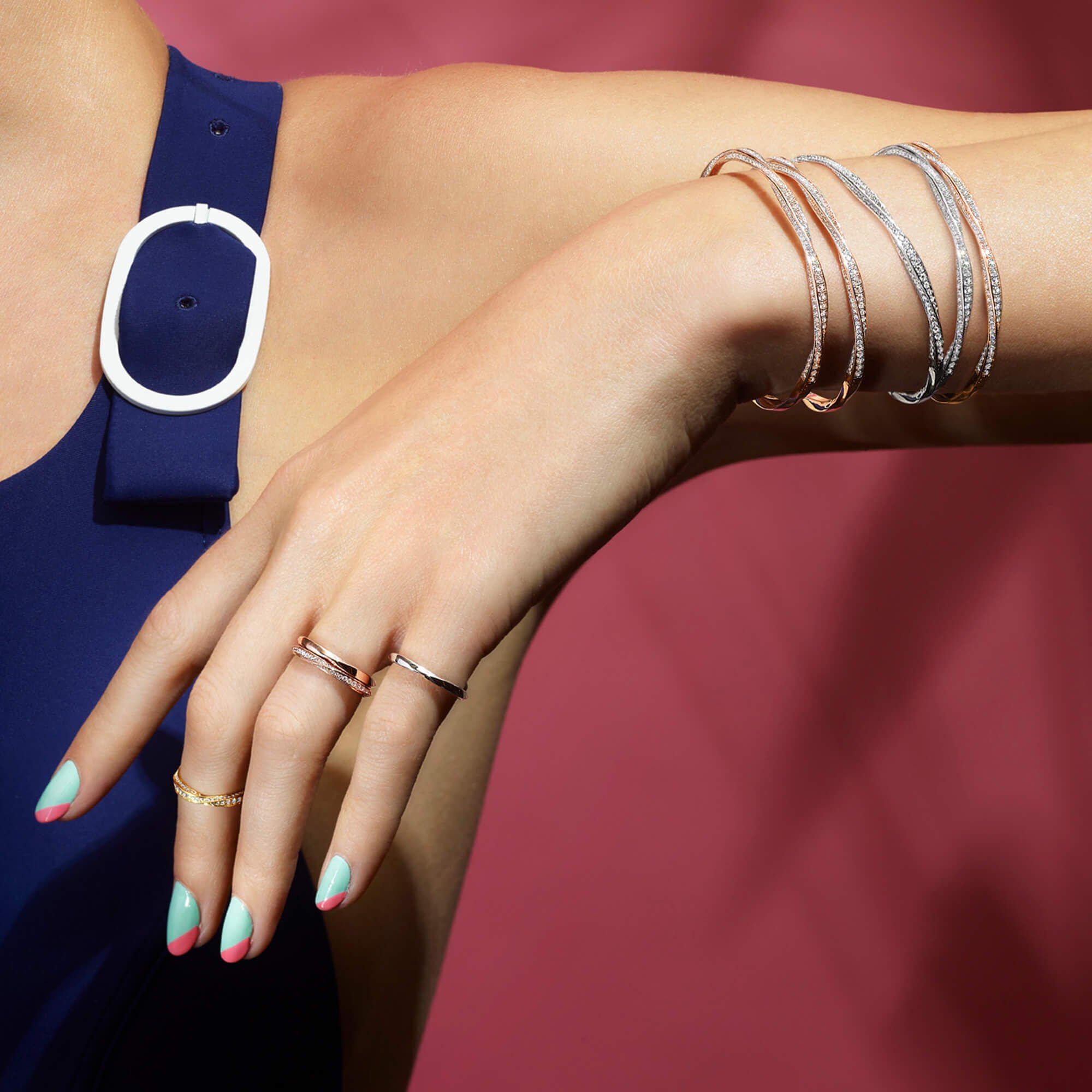 Close up of a model wearing Graff Spiral Jewellery Collection Rings and Bracelets
