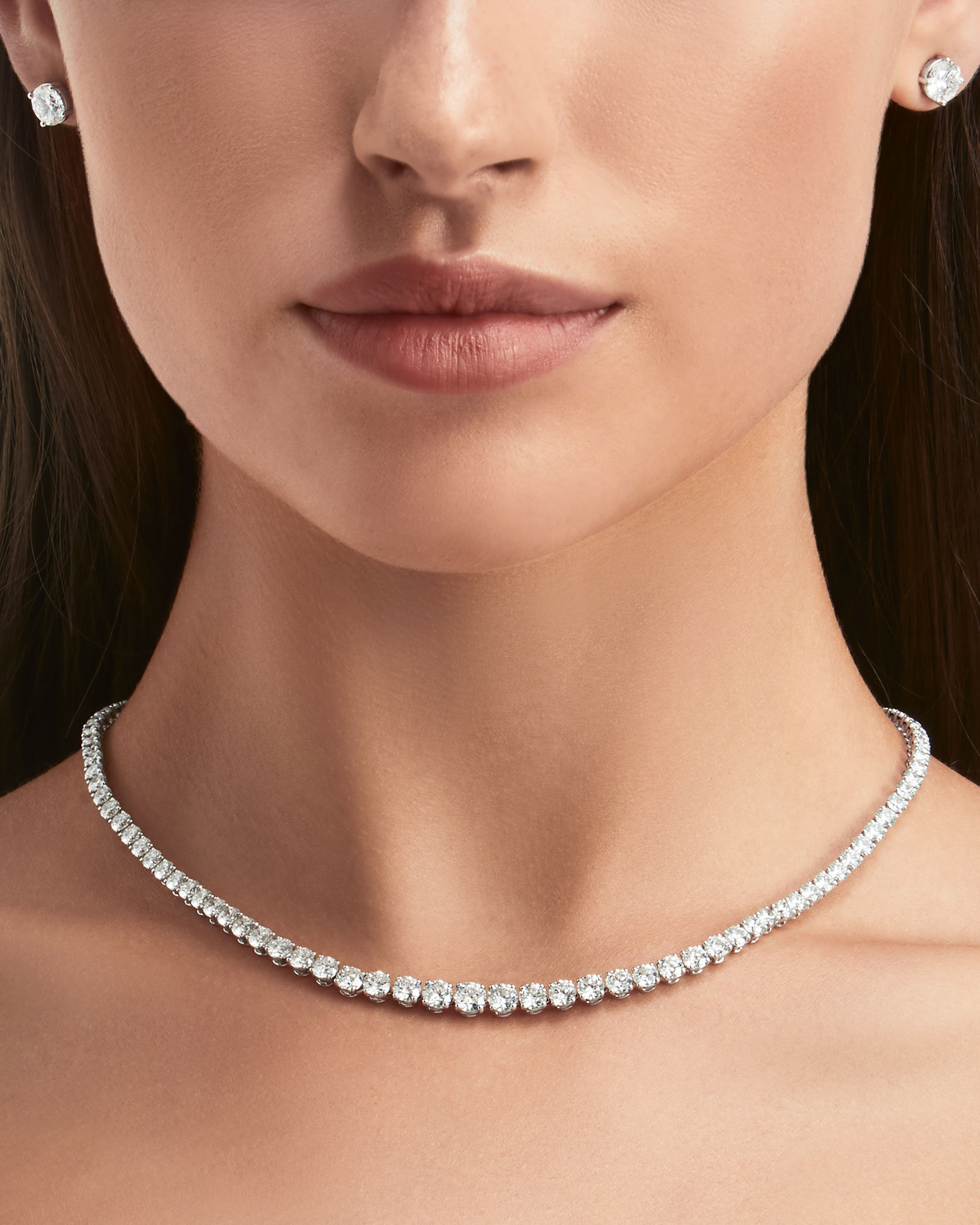 Close up of a model wears Classic Graff collection diamond jewellery