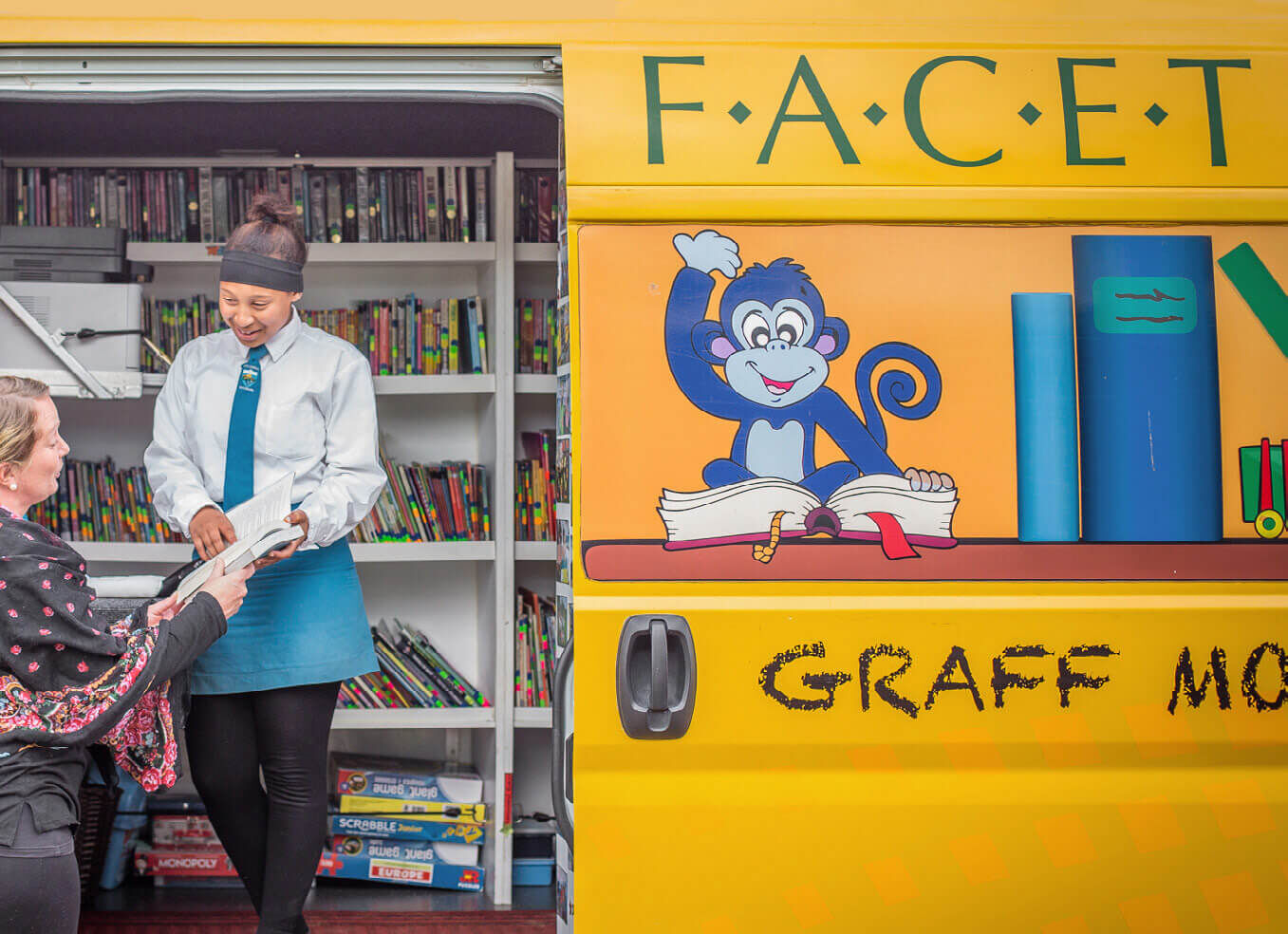 Students talking to a teacher in the Graff mobile learning center in South Africa