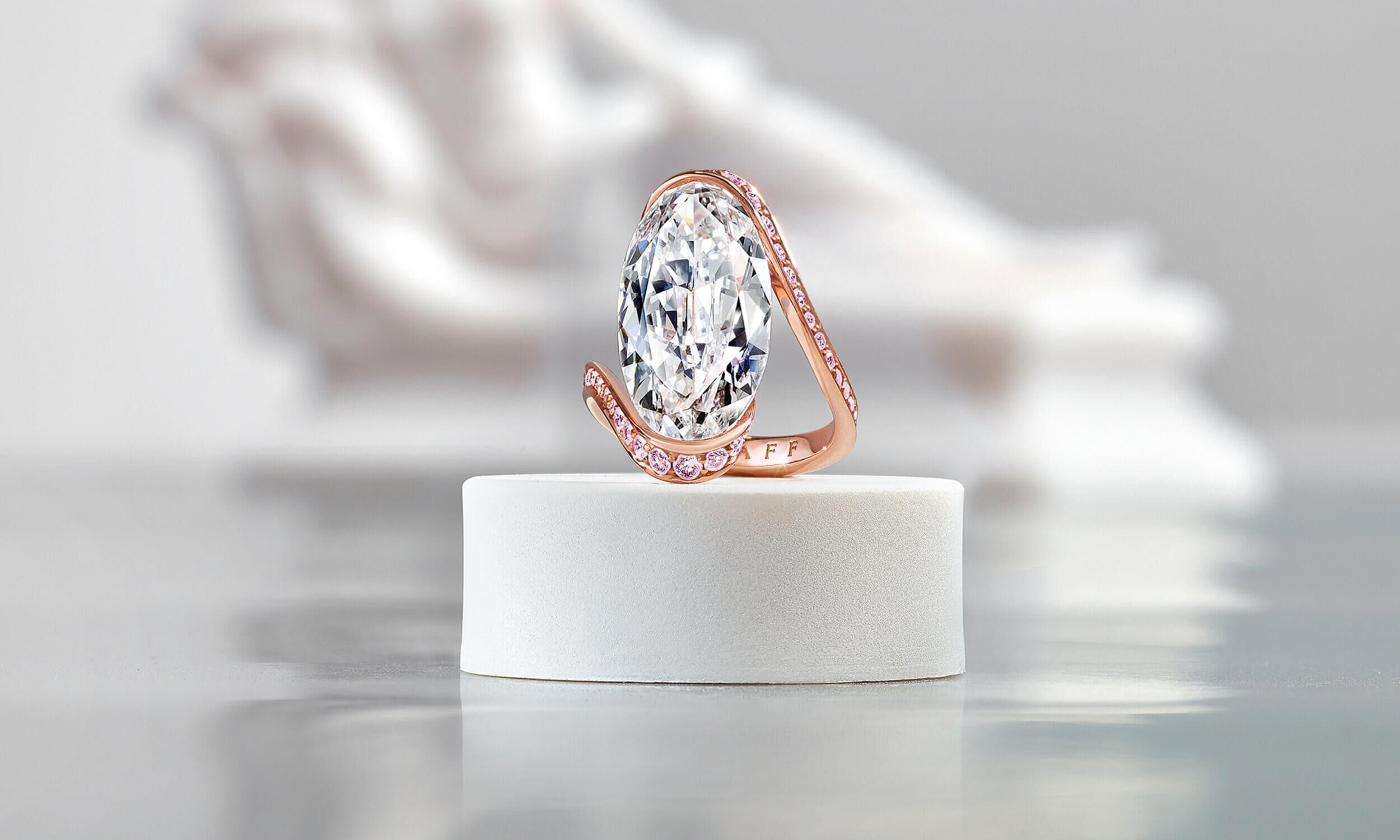 Graff D Internally Flawless White Oval Diamond High Jewellery Ring With Pink Pave Diamond Swirl Surround inside a Gallery