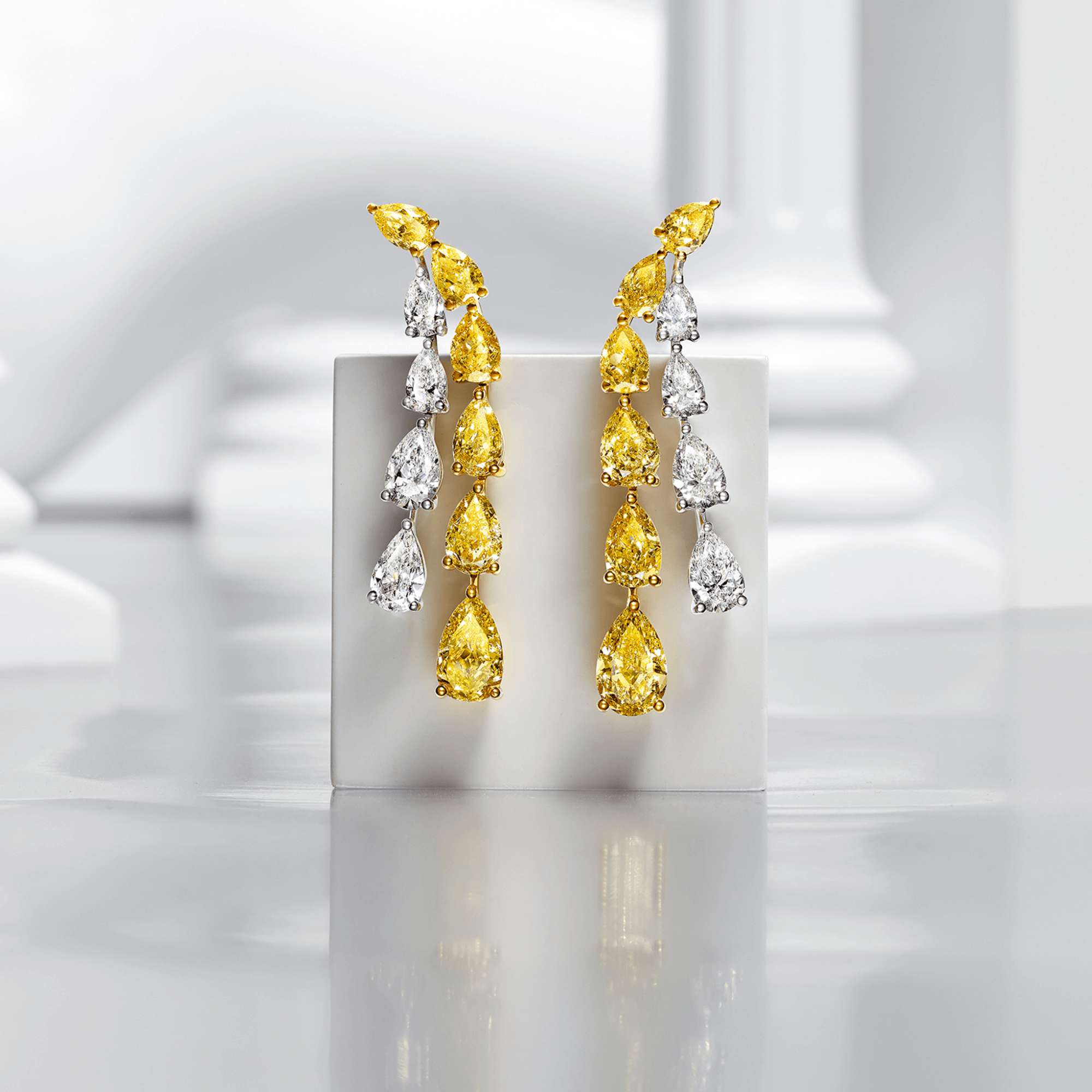 Graff Yellow And White Pearshape Diamond High Jewellery Earrings inside a Gallery.