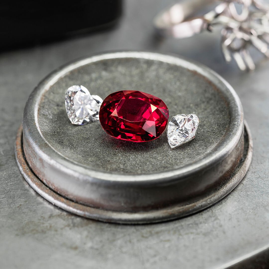 Image of loose ruby and white diamond stones in Graff workshop