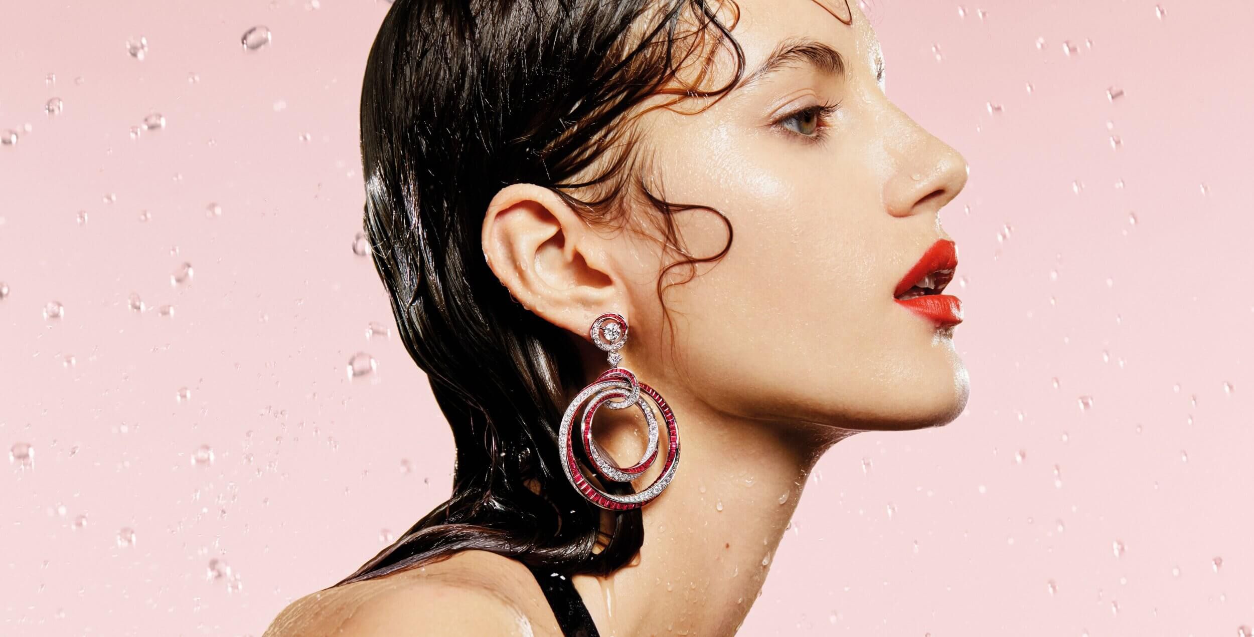 A model wearing Graff Spiral Collection Ruby and Diamond Hoop Earrings