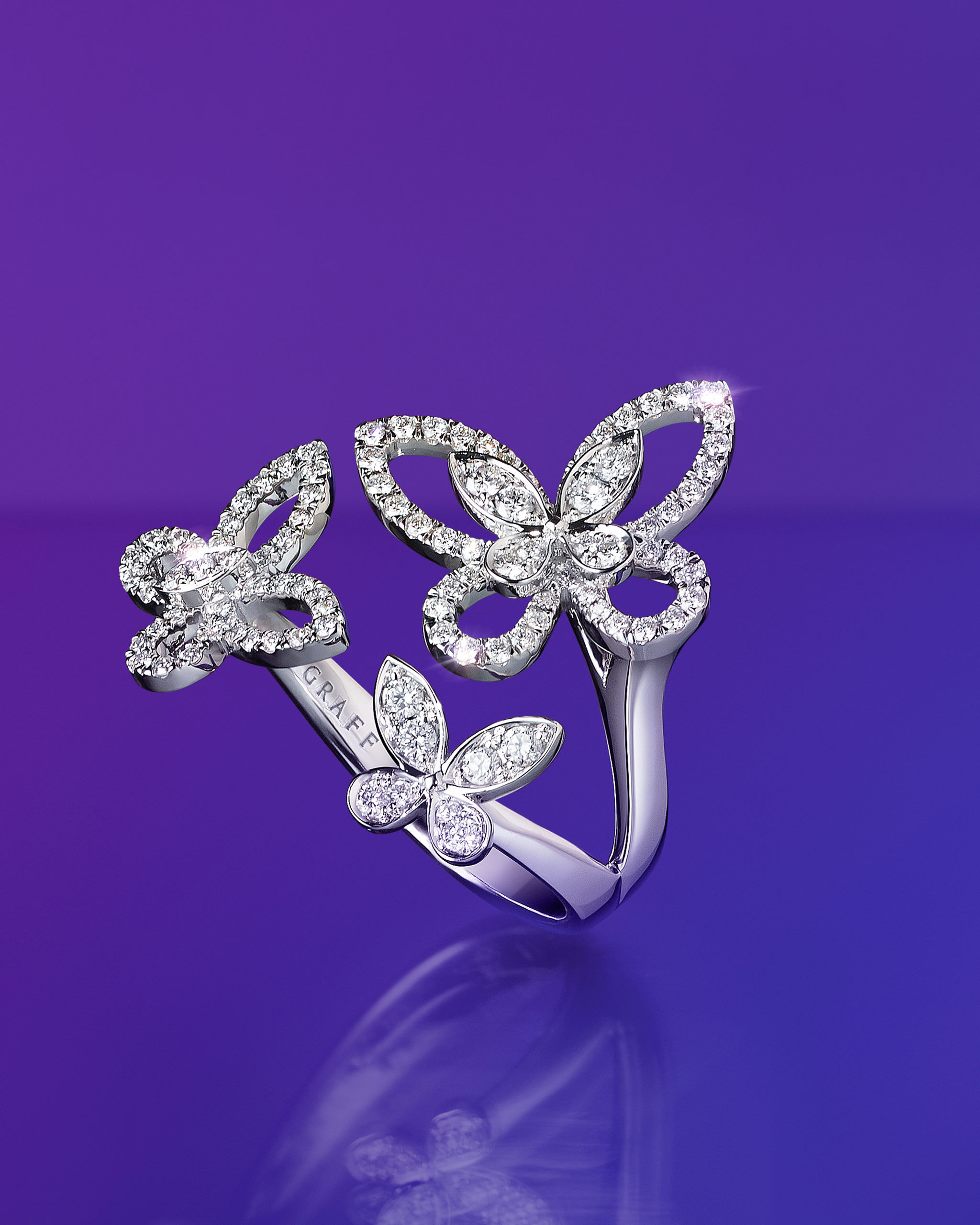 Model wear the Graff Wild Flower collection diamond rings