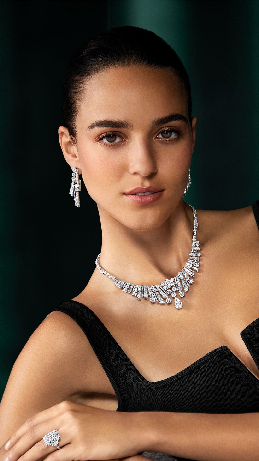 Image shows model wearing Graff White Diamond High Jewellery suite