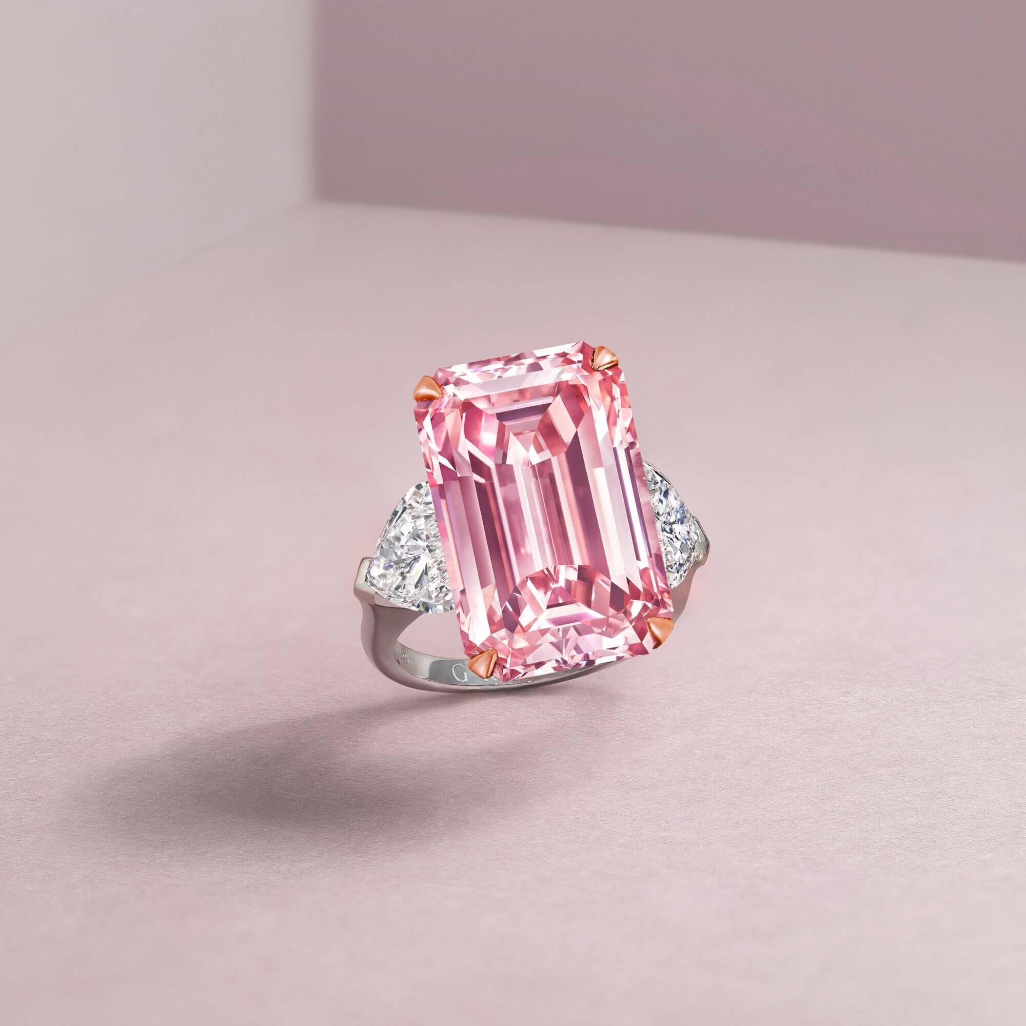 This important diamond ring features an exquisite 16.88 carat Fancy Intense Pink Internally Flawless emerald cut diamond