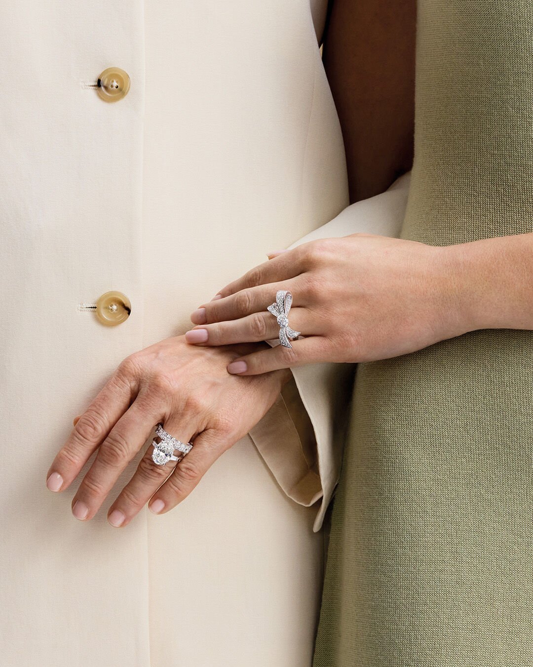 Engagement rings - image shows model wearing Graff oval cut diamond engagement ring