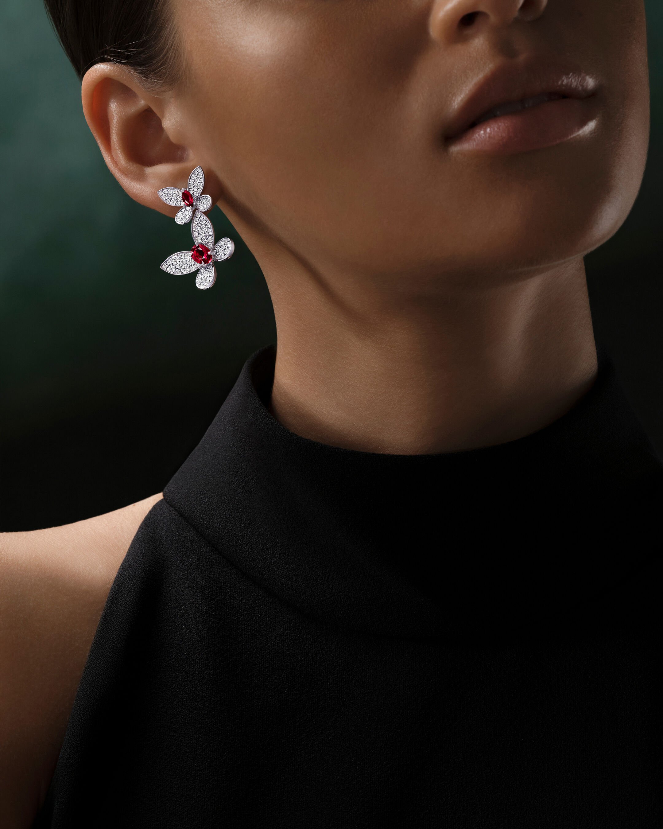 Image shows model wearing Laurence Graff Signature bangles and rings 